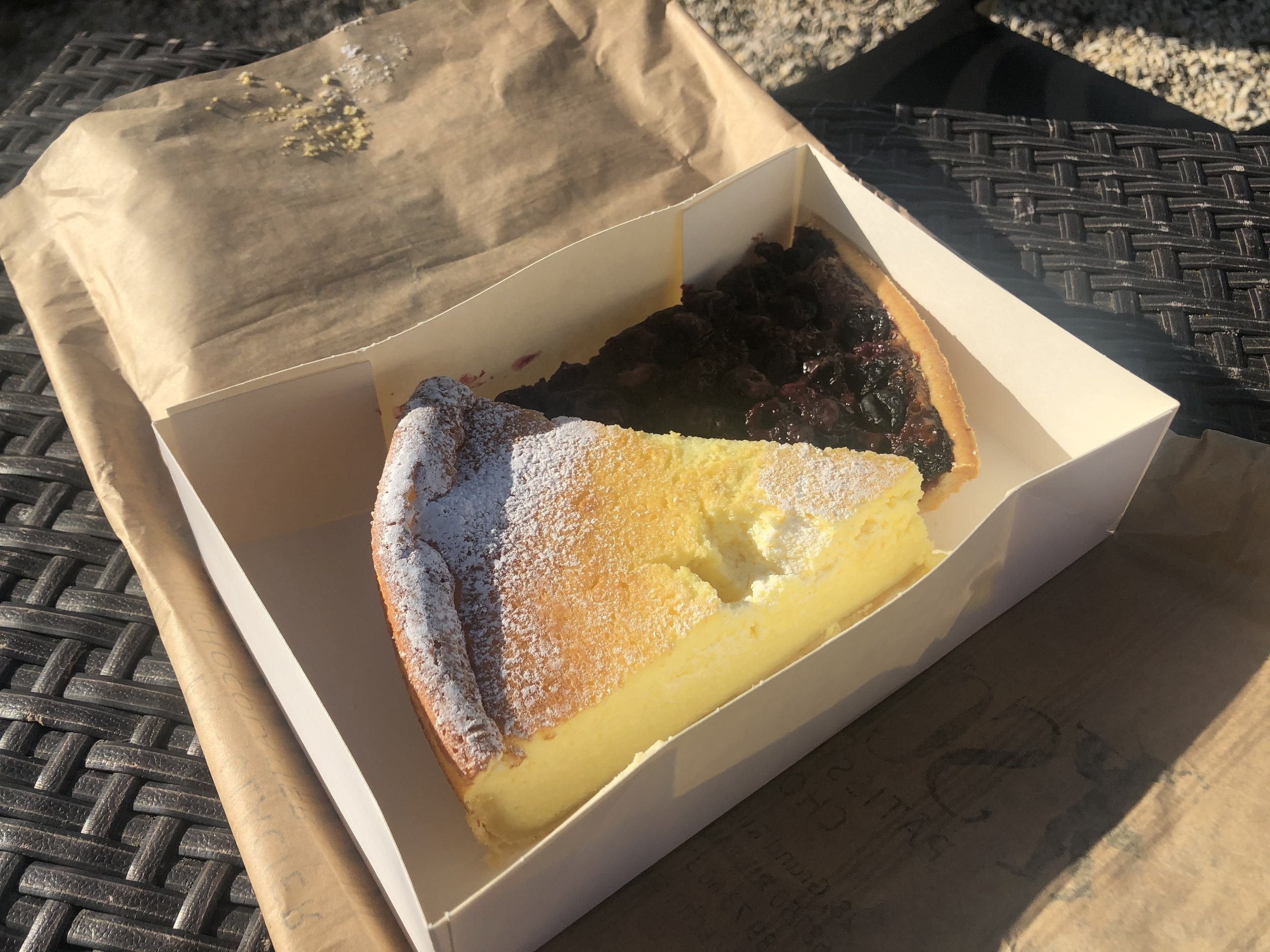 Two slices of tart in a cardboard cake box