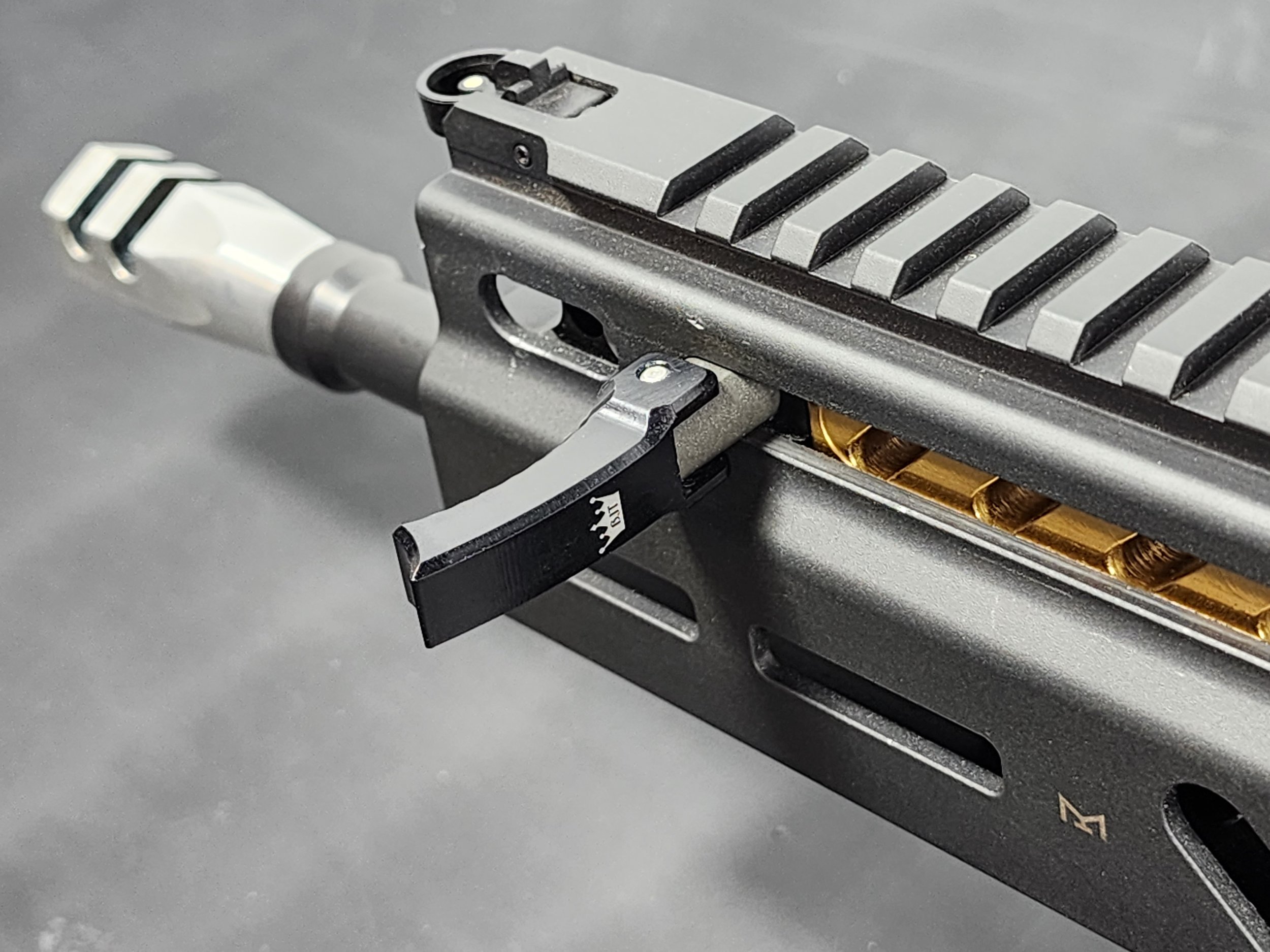 stribog-folding-charging-handle-open-left-top-installed.jpg