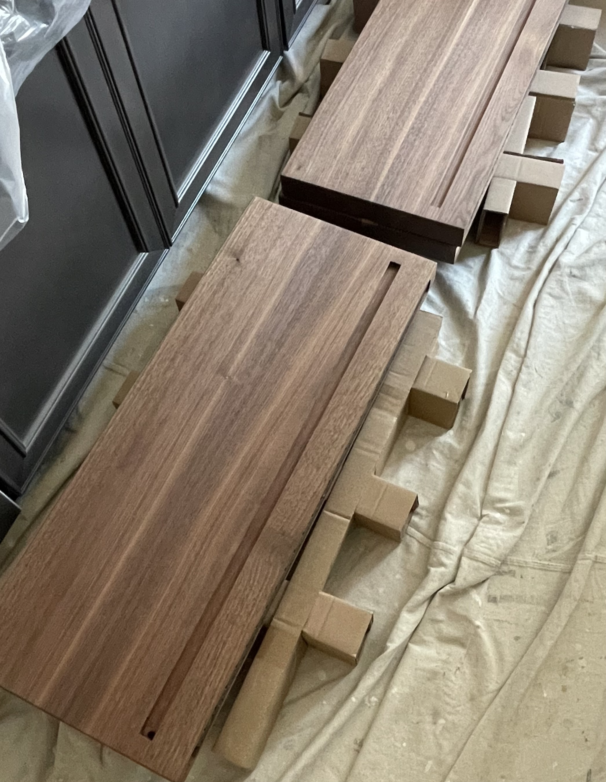 Solid Walnut Floating Shelves with inlay down and upcast lighting for a residence in Milton Delaware