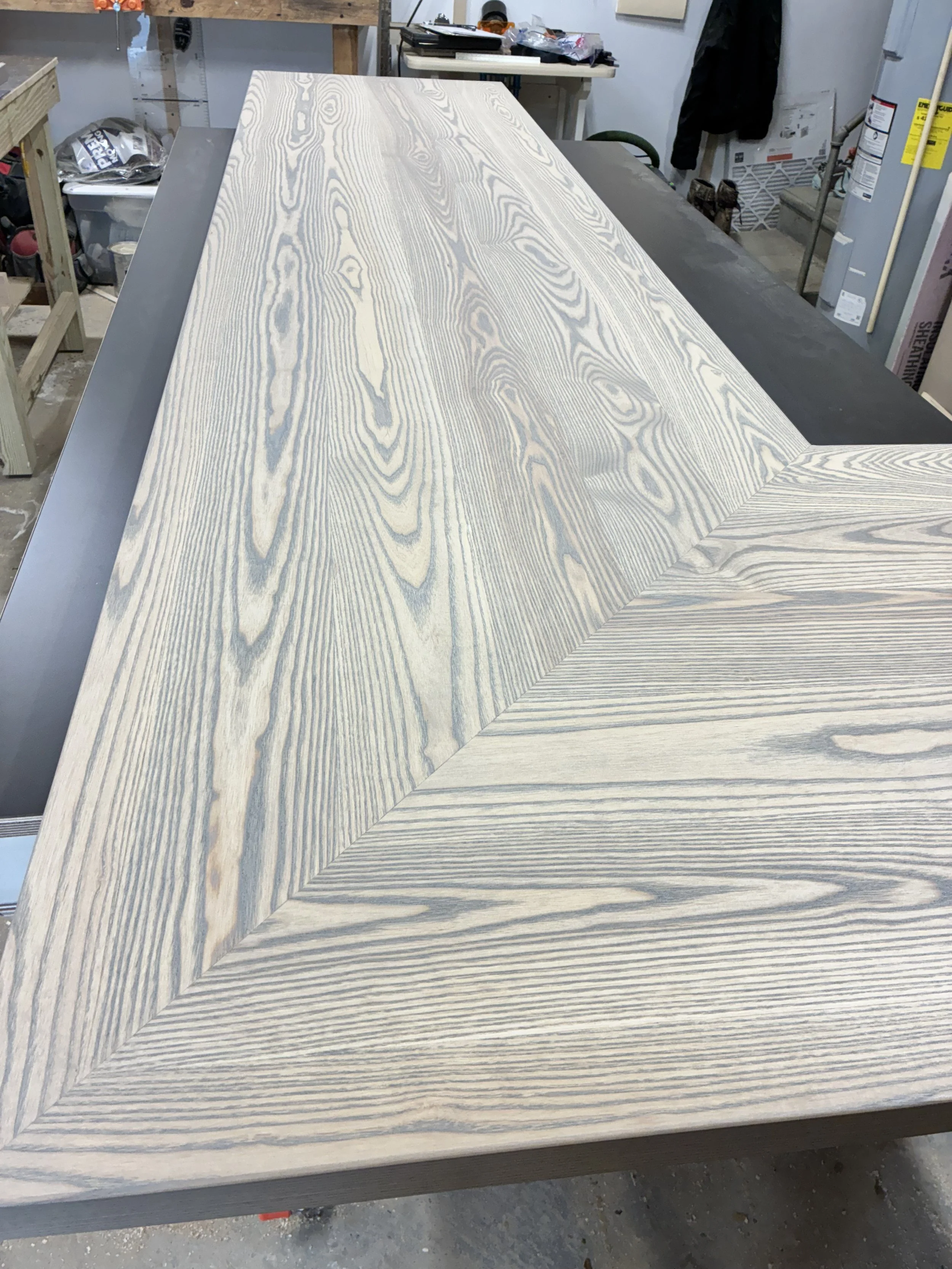 Ash Countertop stained in a gray wash for a wine room in Fenwick, Delaware