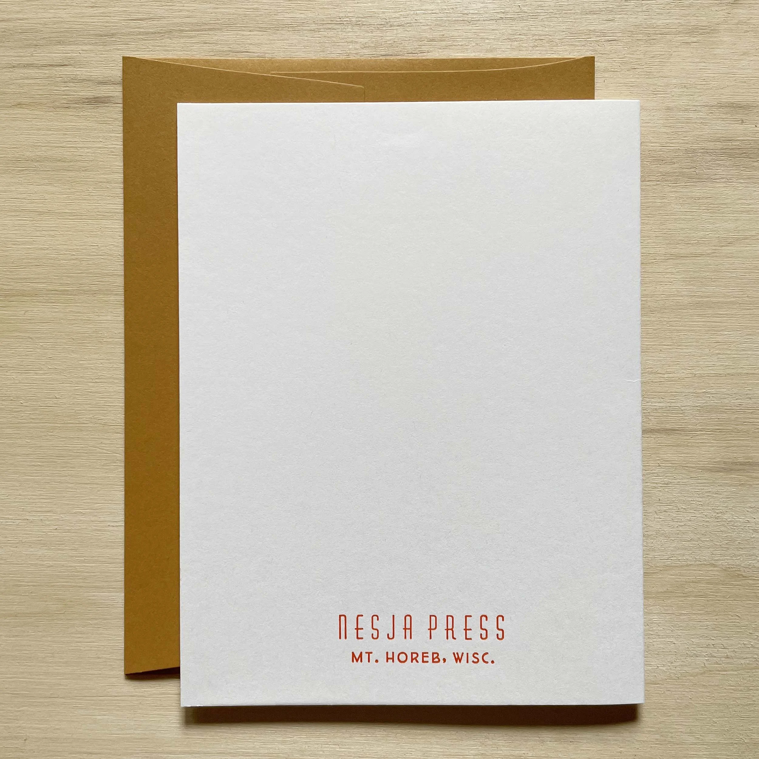 Folded card, closed, showing the back side with the Nesja Press logo and Mt. Horeb, Wisc. letterpress printed in small type near the bottom of the card.