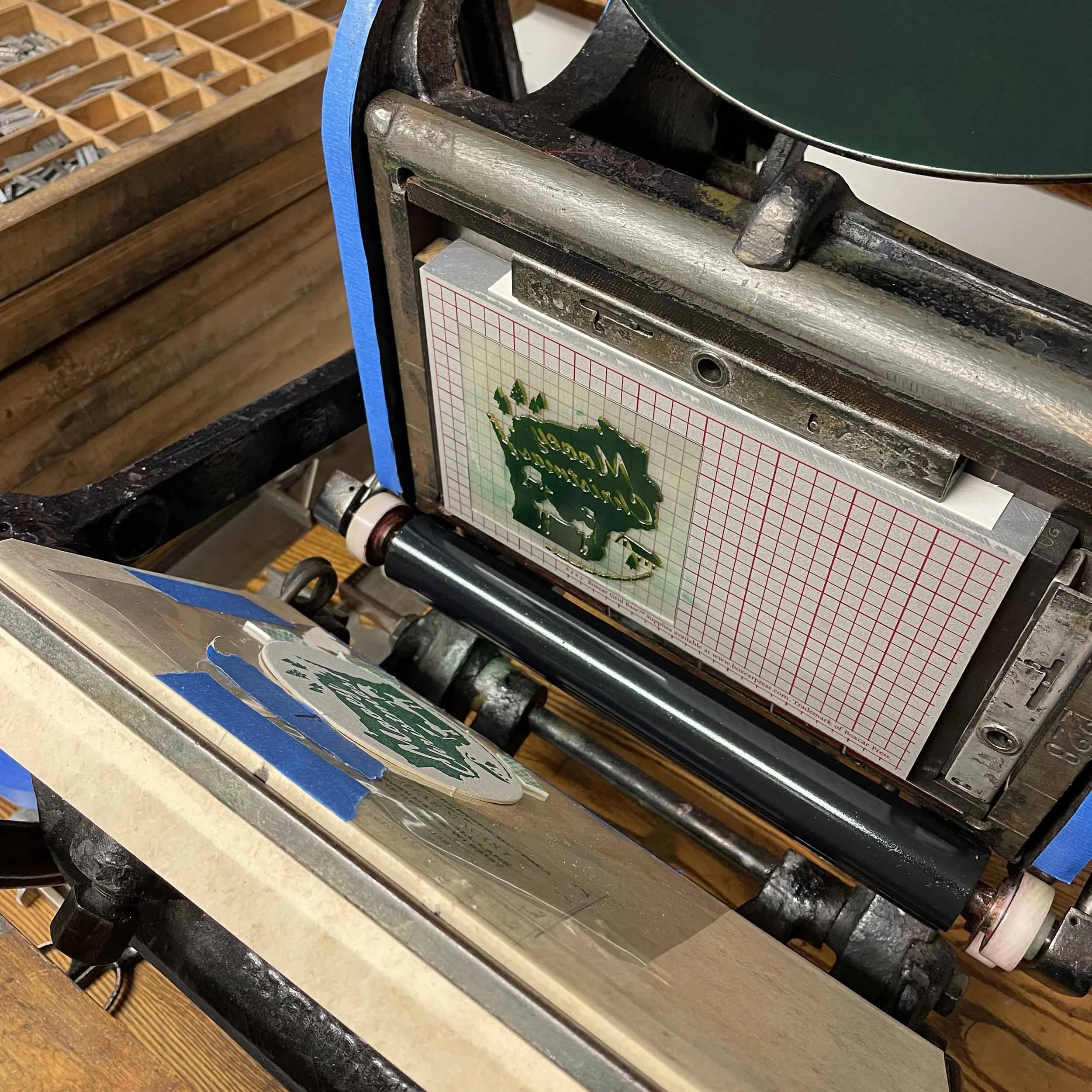 mooey-christmas-wisconsin-letterpress-ornament-green-ink-on-press.jpg