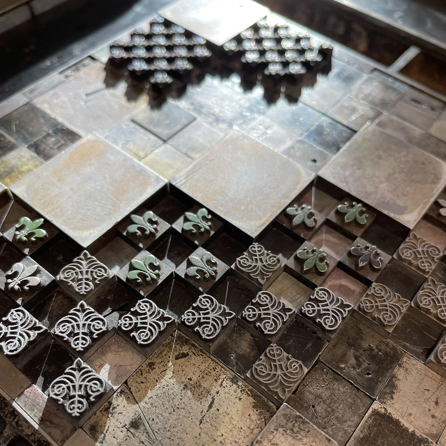Close up of type and ornaments locked up.
