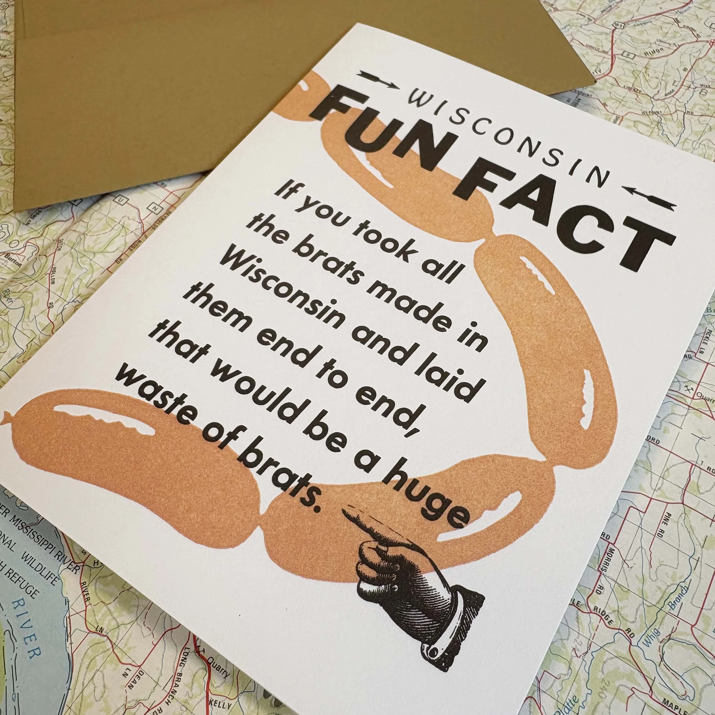 Wisconsin Fun Fact, If you took all the brats made in Wisconsin and laid them end to end, that would be a huge waste of brats. Kraft paper brown envelope.