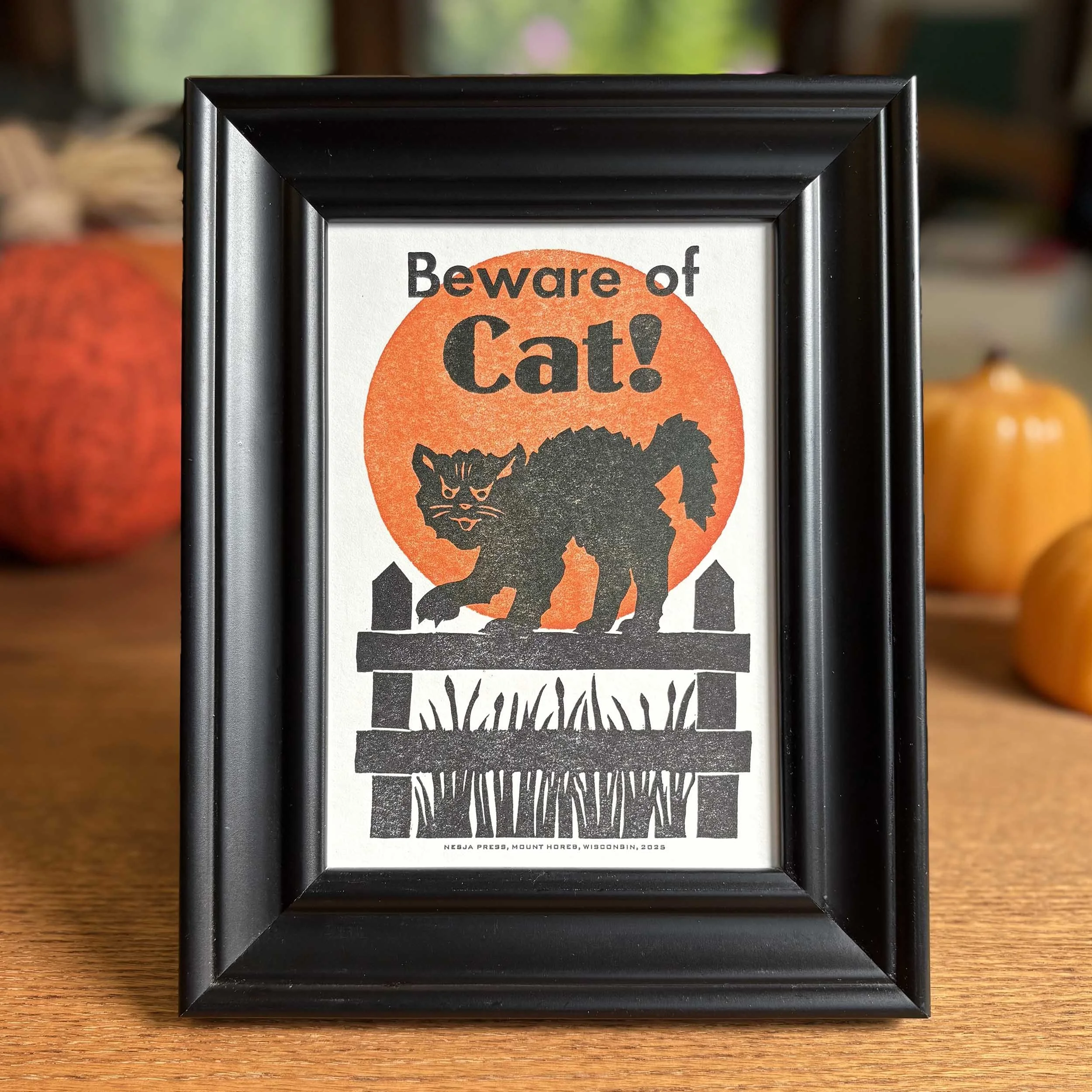'Beware of Cat!' art print is shown in a standard 5 x 7 black frame.