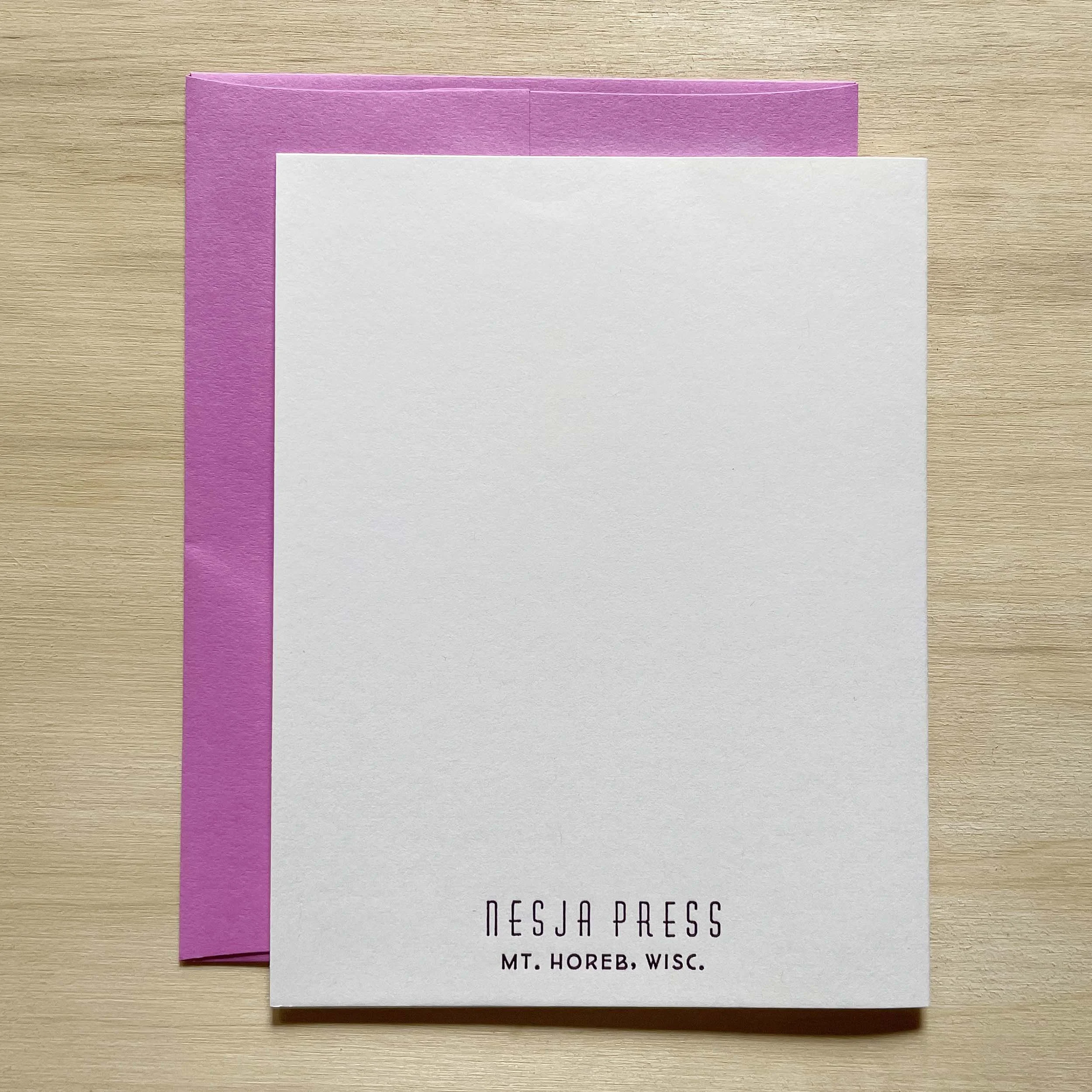 Folded card, closed, showing the back side with the Nesja Press logo and Mt. Horeb, Wisc. letterpress printed in small type near the bottom of the card.