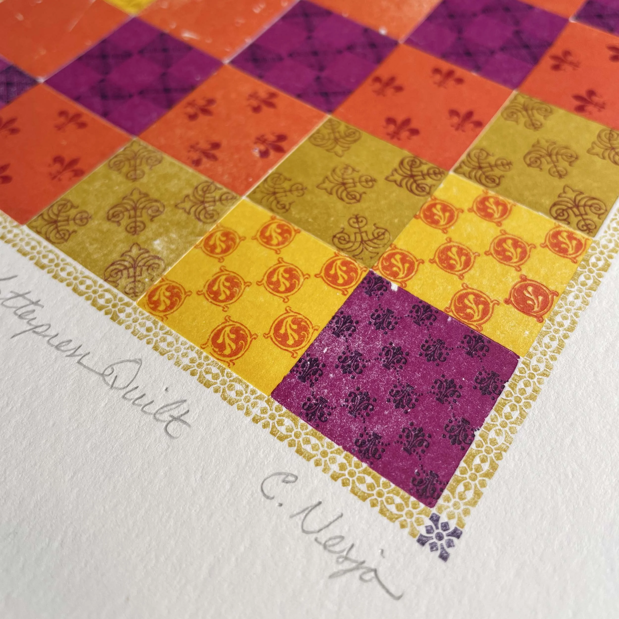 Detail of bold color patchwork quilt printed on white paper in shades of orange, yellow, and purple. Each square within the larger square has a different pattern. Artist signature visible.