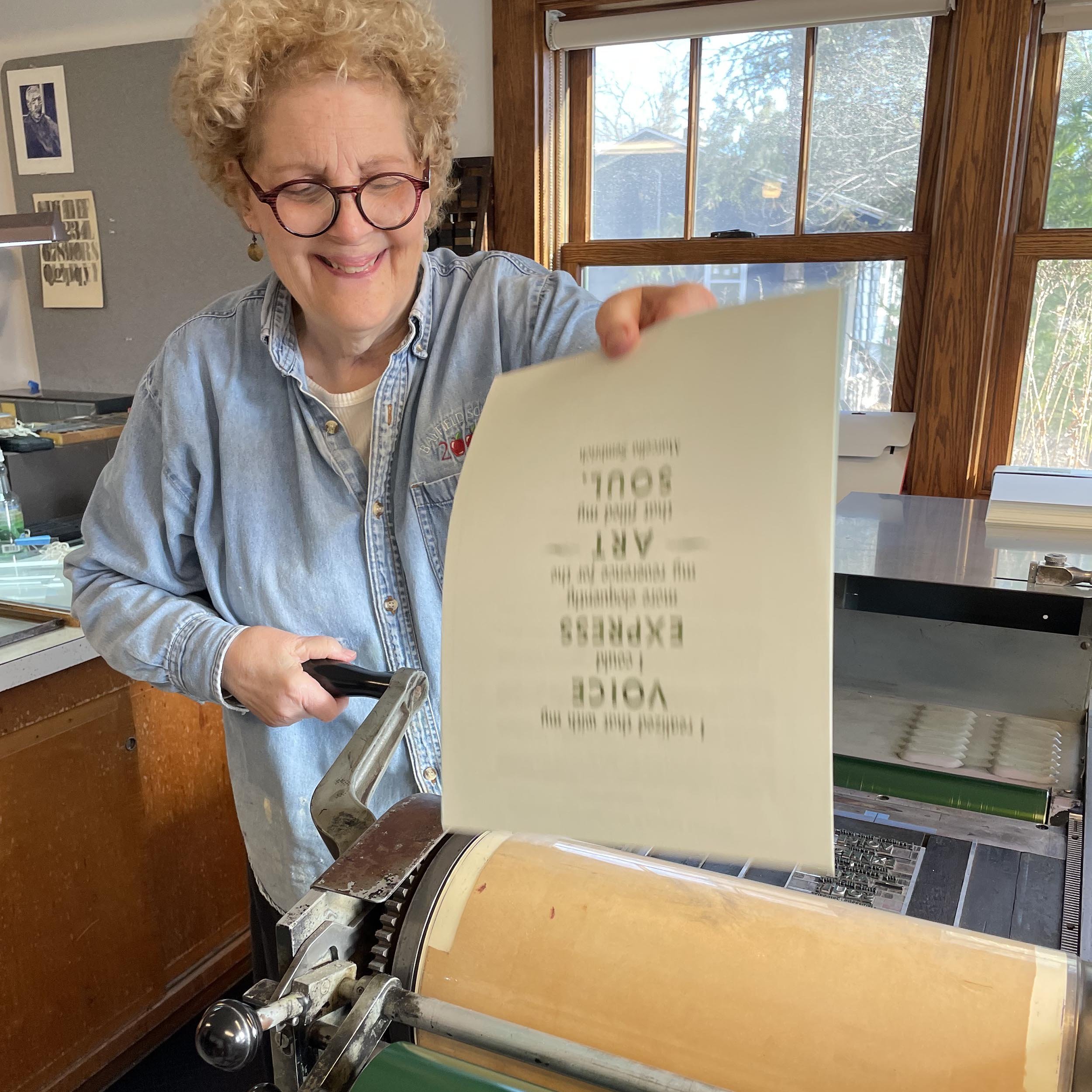 poetry-typesetting-workshop-student-pulling-a-print.jpg