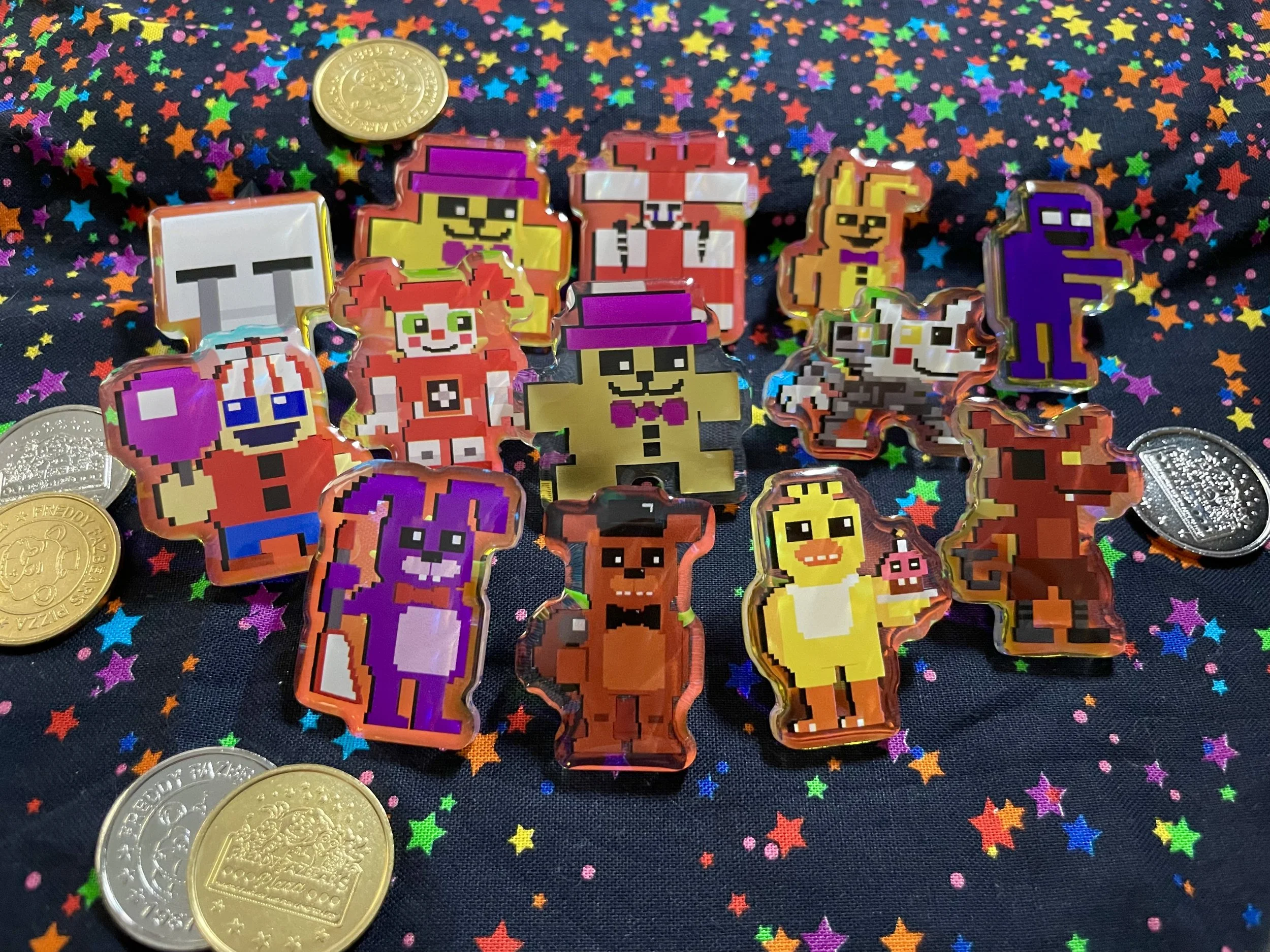 Pixel art style character stickers of cartoon animals and humanoid figures, arranged on a dark background with colorful star-shaped confetti and four coins nearby.