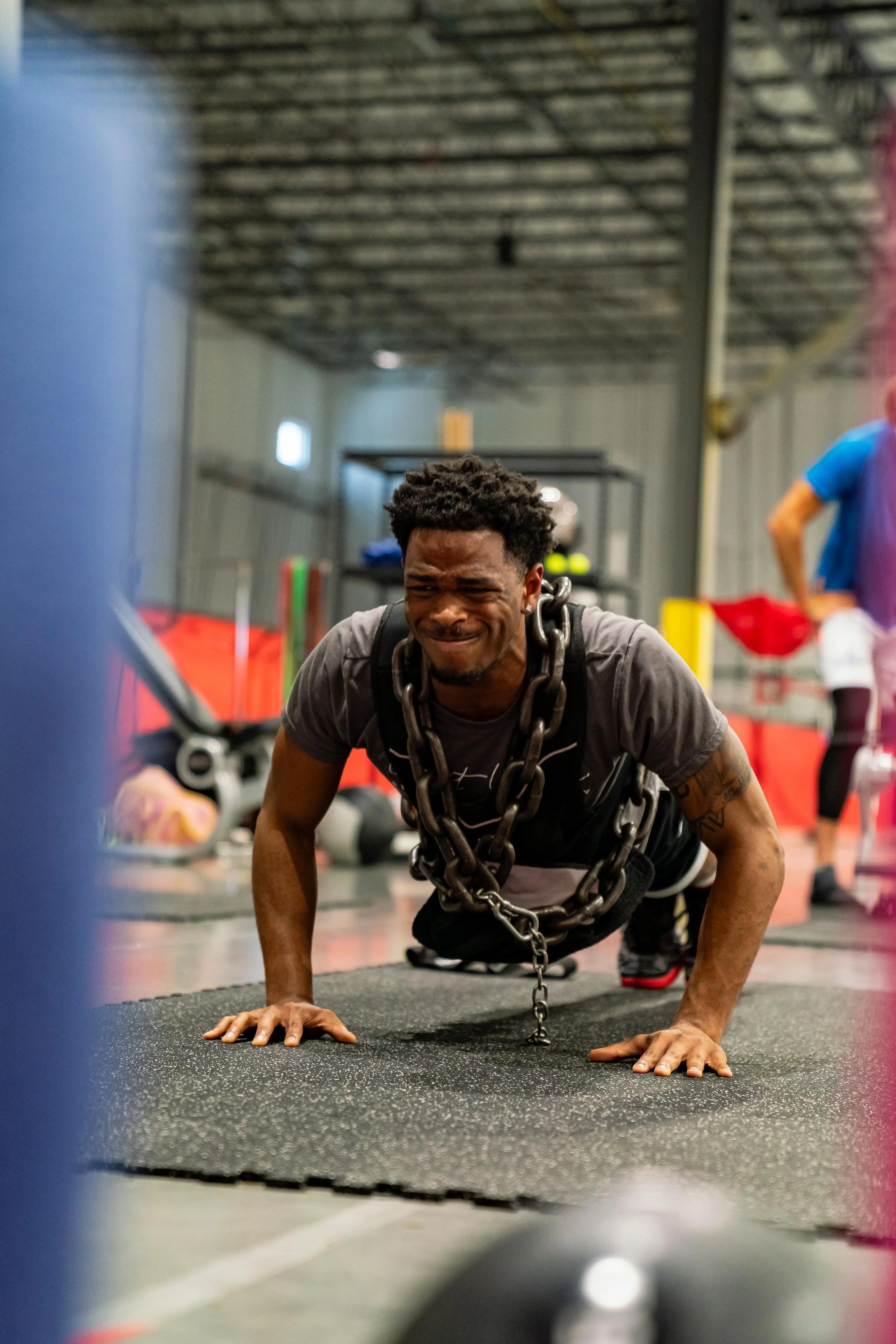 Athlete performing a different chain-weighted push-up