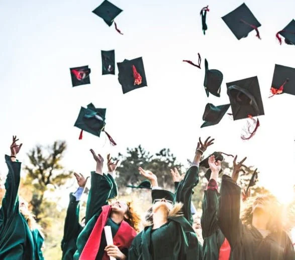 graduates throwing mortarboards