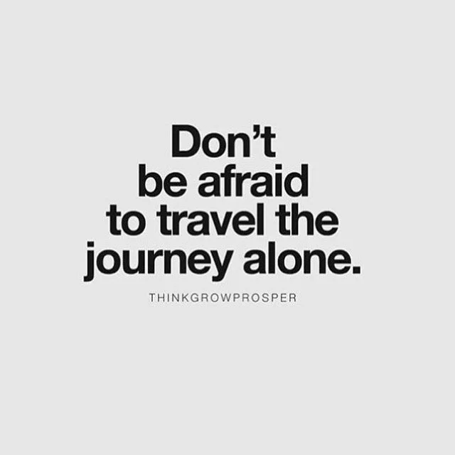 Inspirational quote encouraging travel without fear, reading "Don't be afraid to travel the journey alone."