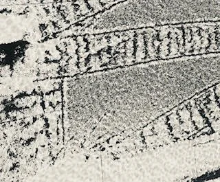 Close-up image of engraved or etched text on a metallic or stone surface.