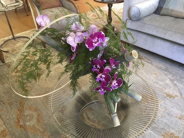 Barbara's party: Phalaenopsis orchids, Asparagus fern, Custom made bamboo container
