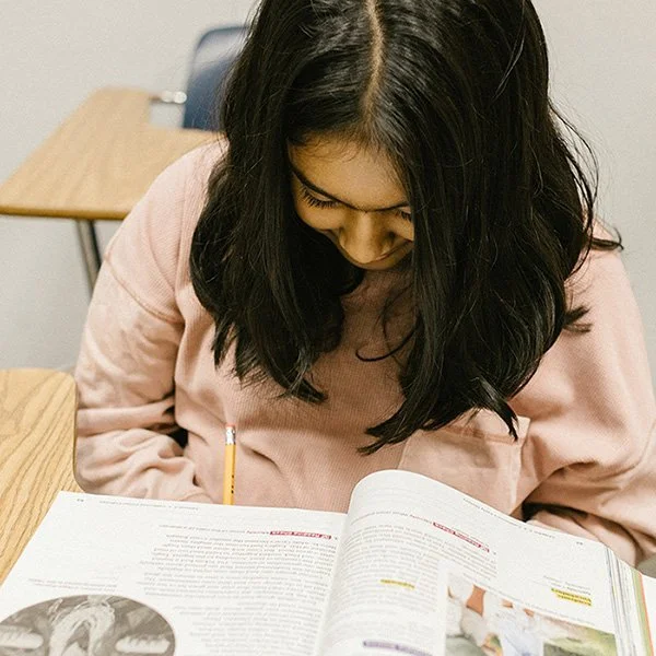 Girl reading a textbook