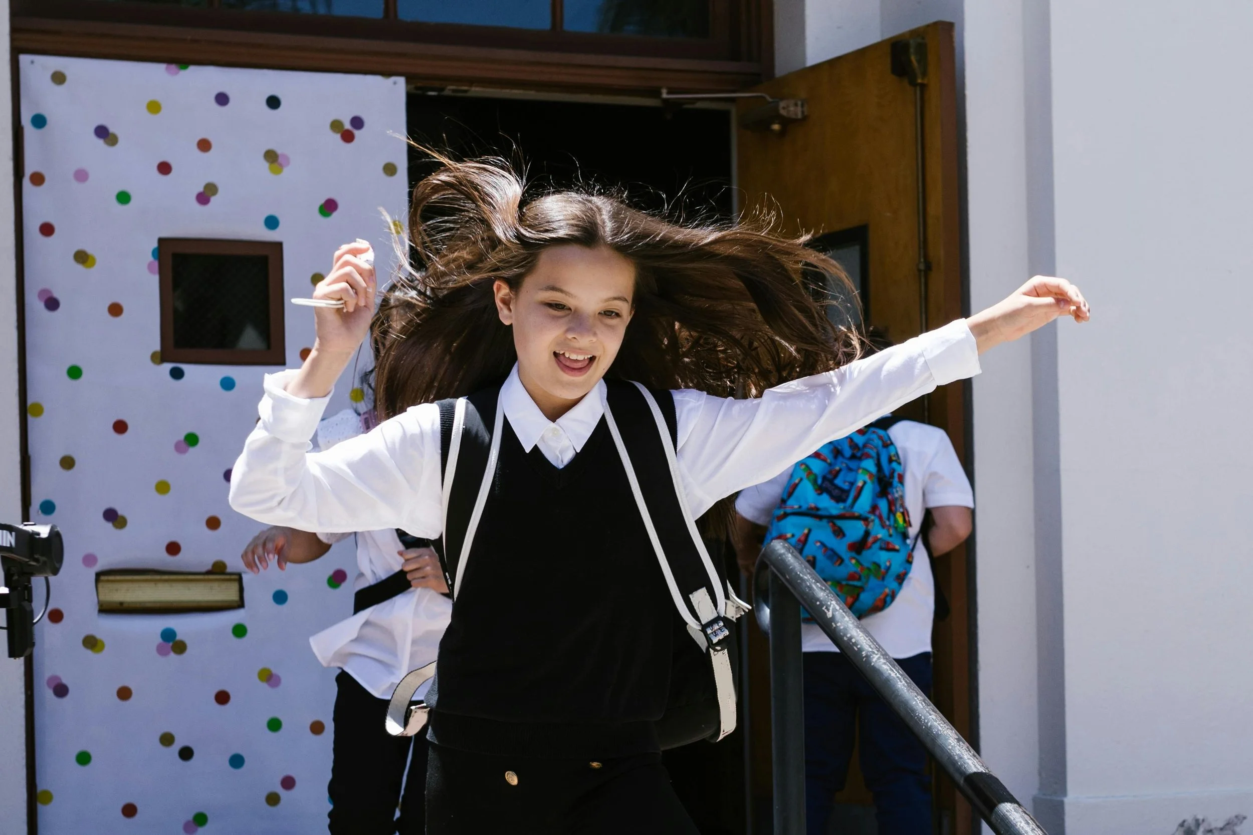 A photograph of a student leaving school.