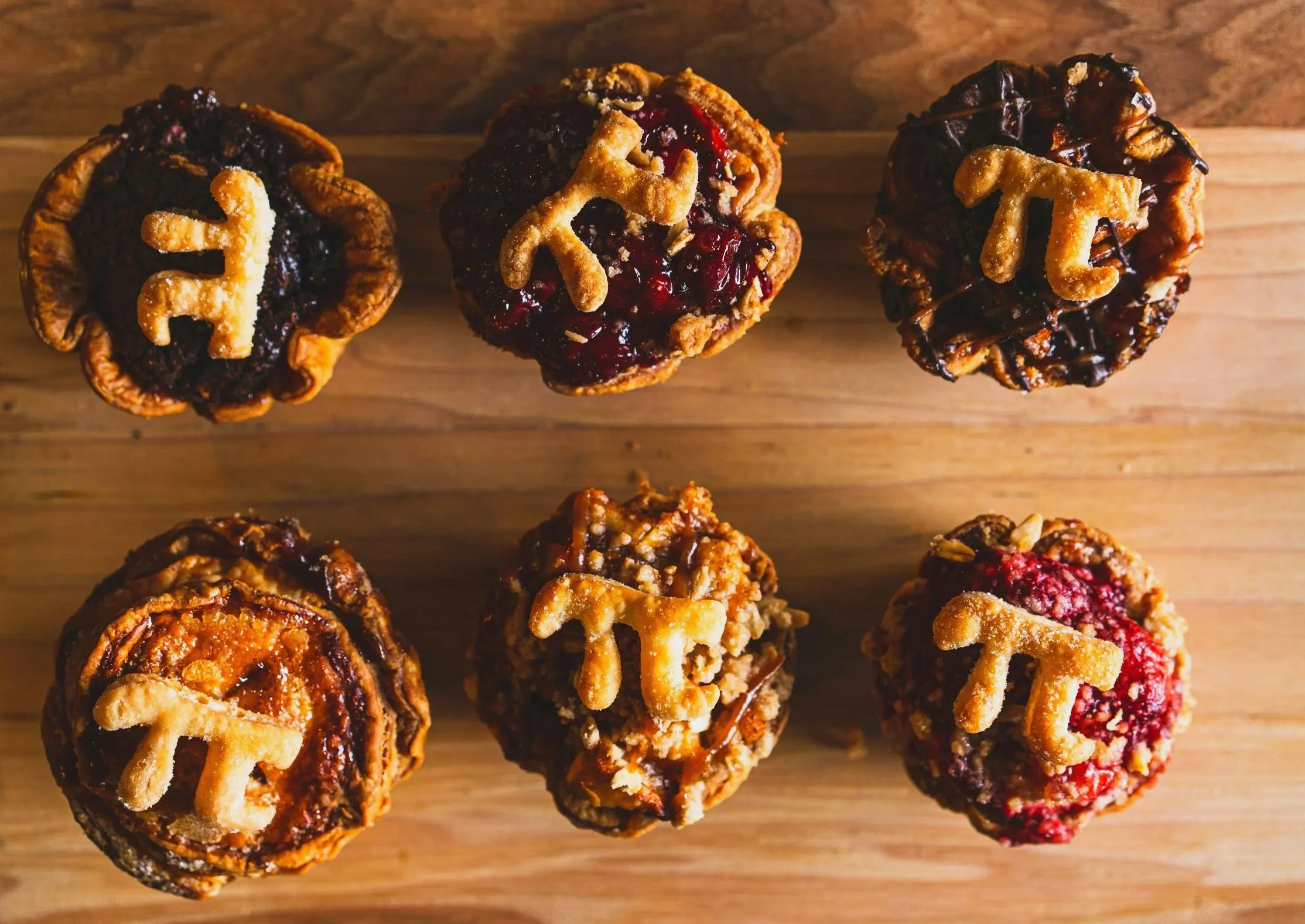 Six small pies with the pi symbol on top
