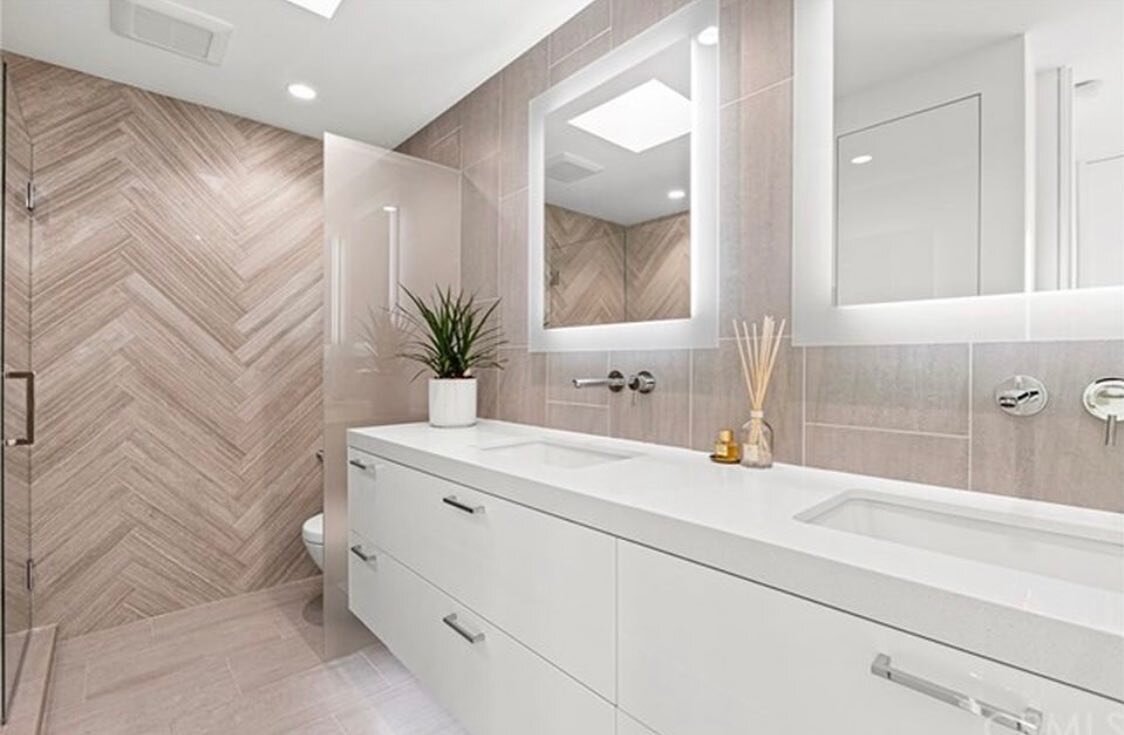 Check out the Herringbone tile in this dream bathroom suite!