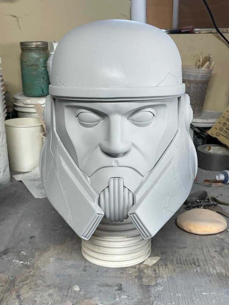 A life-size, wearable replica of Captain Enoch’s helmet from Star Wars: Ahsoka, modeled and 3D printed by Genesys EFX. The piece features a hand-painted, screen-accurate finish personally approved by costumer and lead painter Juda Escalante, matching