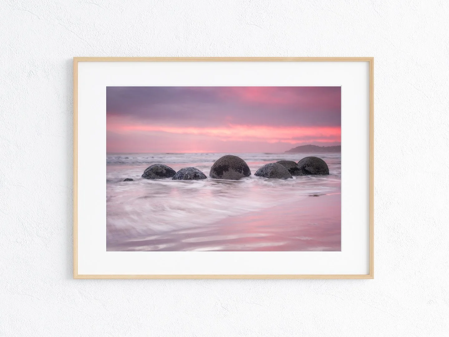 Serenity in Pink: Sunrise at the Moraki Boulders, Waitaki, New Zealand