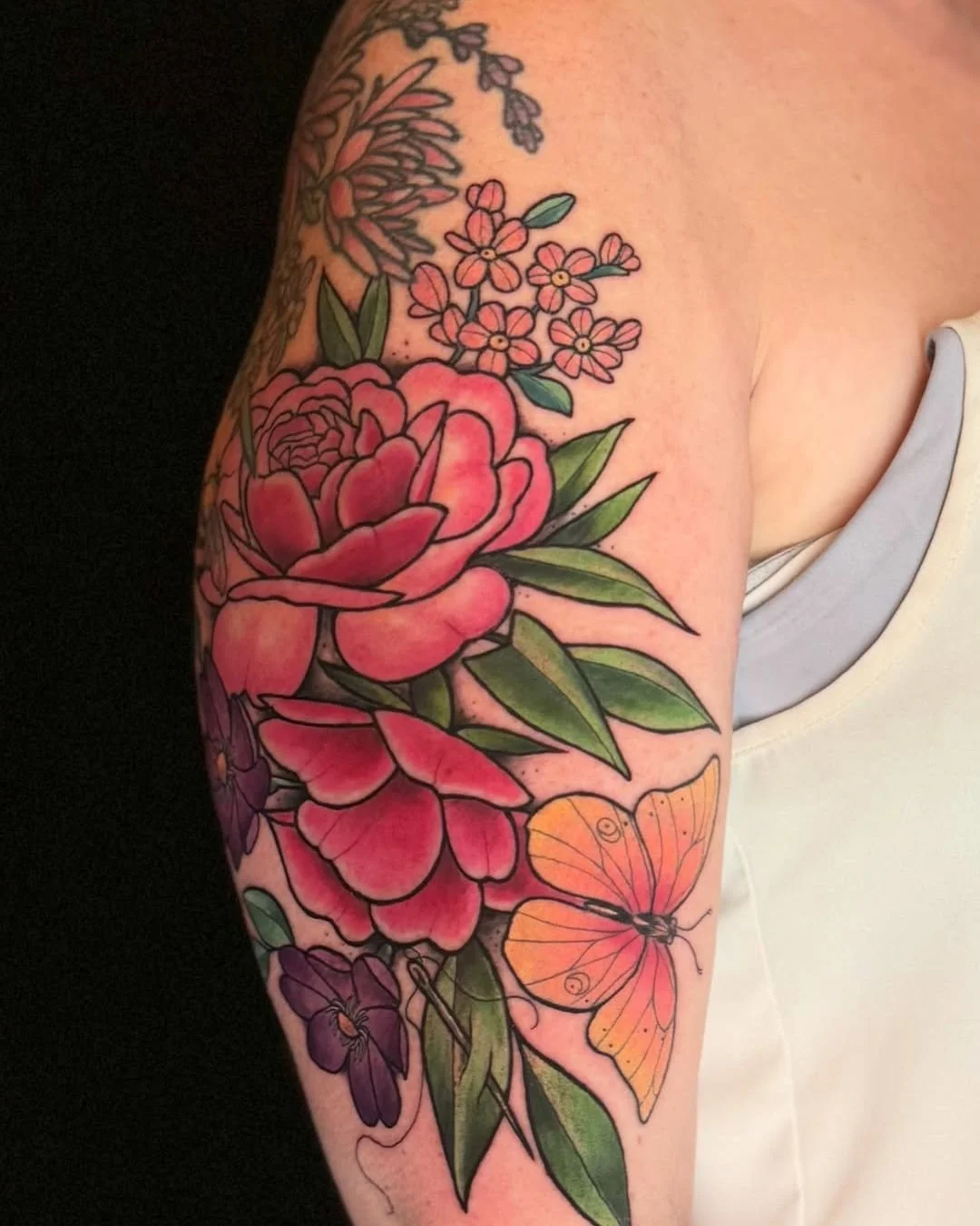 Mel Perlman - @mizmeltattoos is tattooing at @inkanddaggertattoo give them a follow! - We added this bright butterfly and more flowers to bring even more life to her arm!  I love how bold and vibrant this piece has become thank you for letting me kee