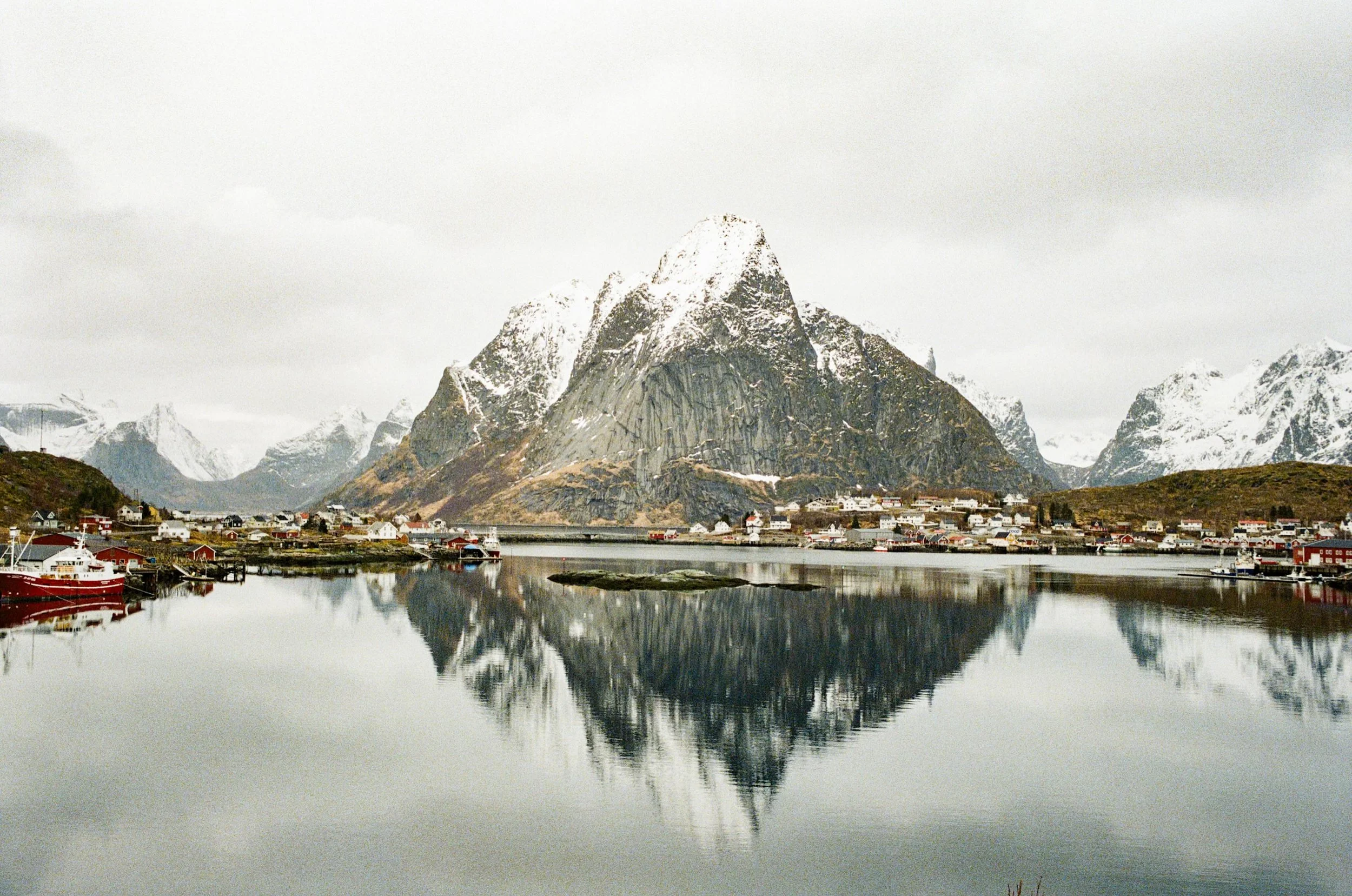 Filming Stillness- Reflections on film carry more than the stillness of a place. They hold the quiet beauty of analogue memory. The soft grains, muted tones creates moments that freezes time. In Lofoten, the mountains stood still while the water mirr