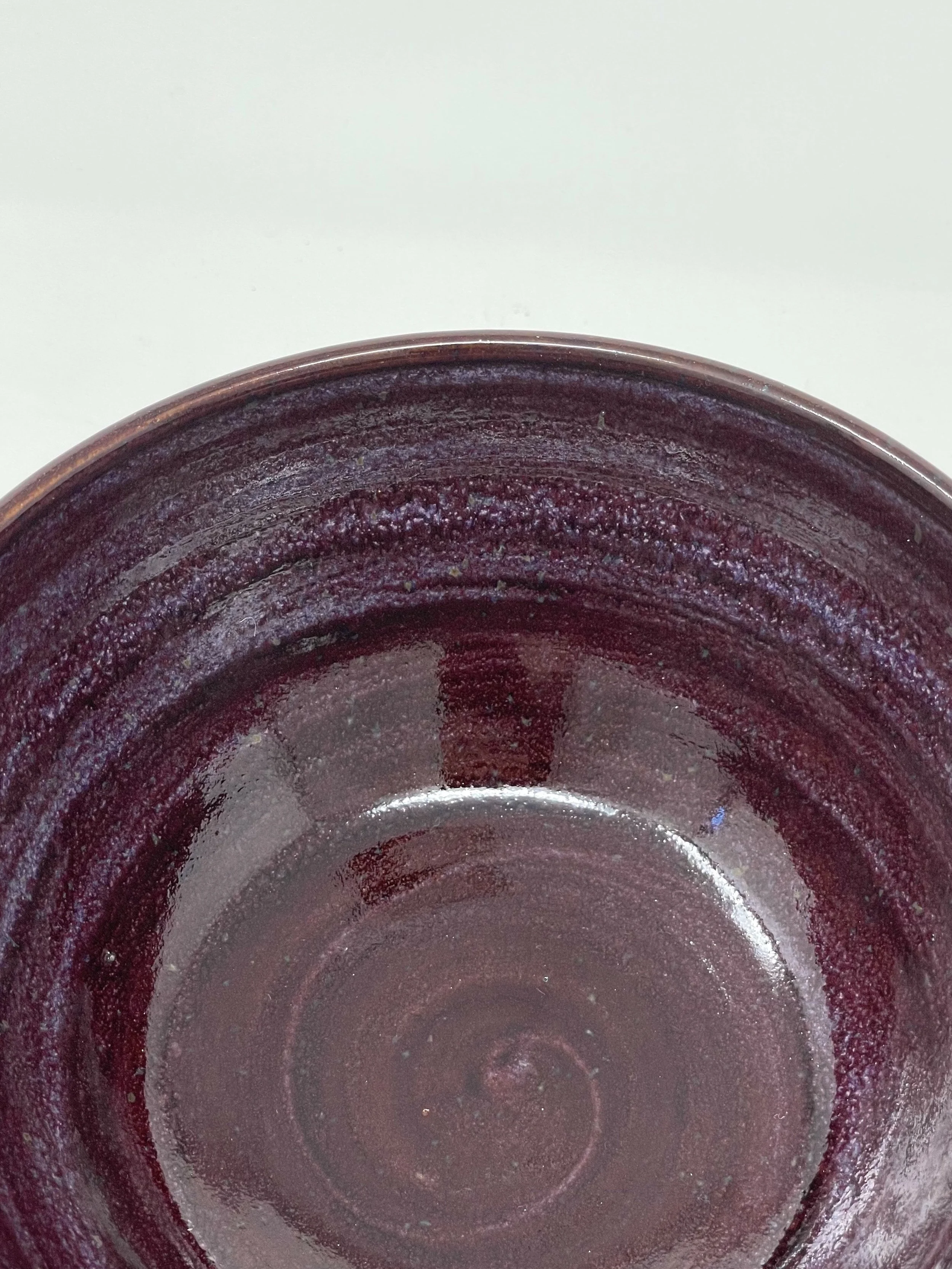 Close-up view of the inside of a purple ceramic bowl.