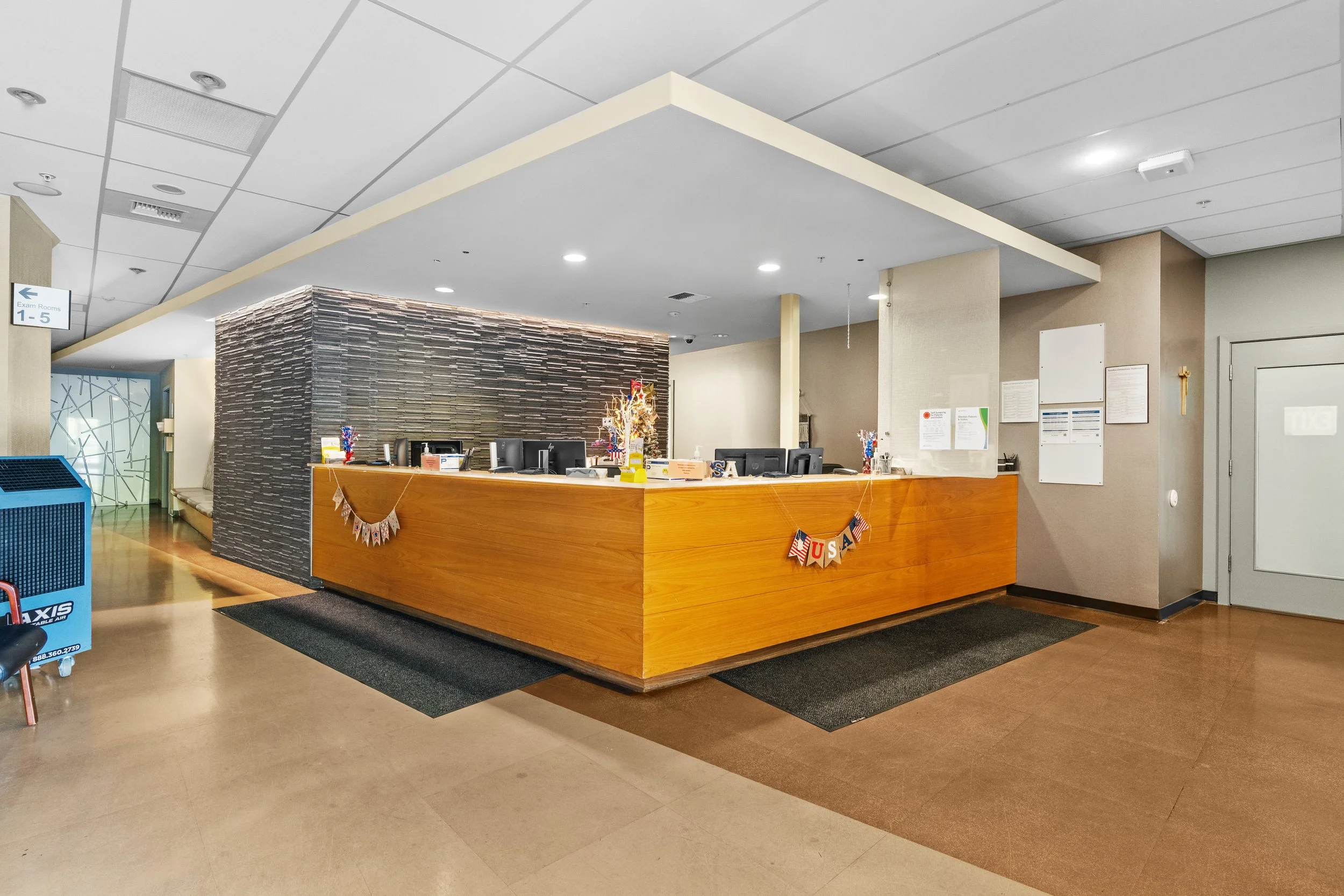 Reception and patient check-in area at the Franciscan Medical Clinic with a spacious front desk and modern healthcare lobby.