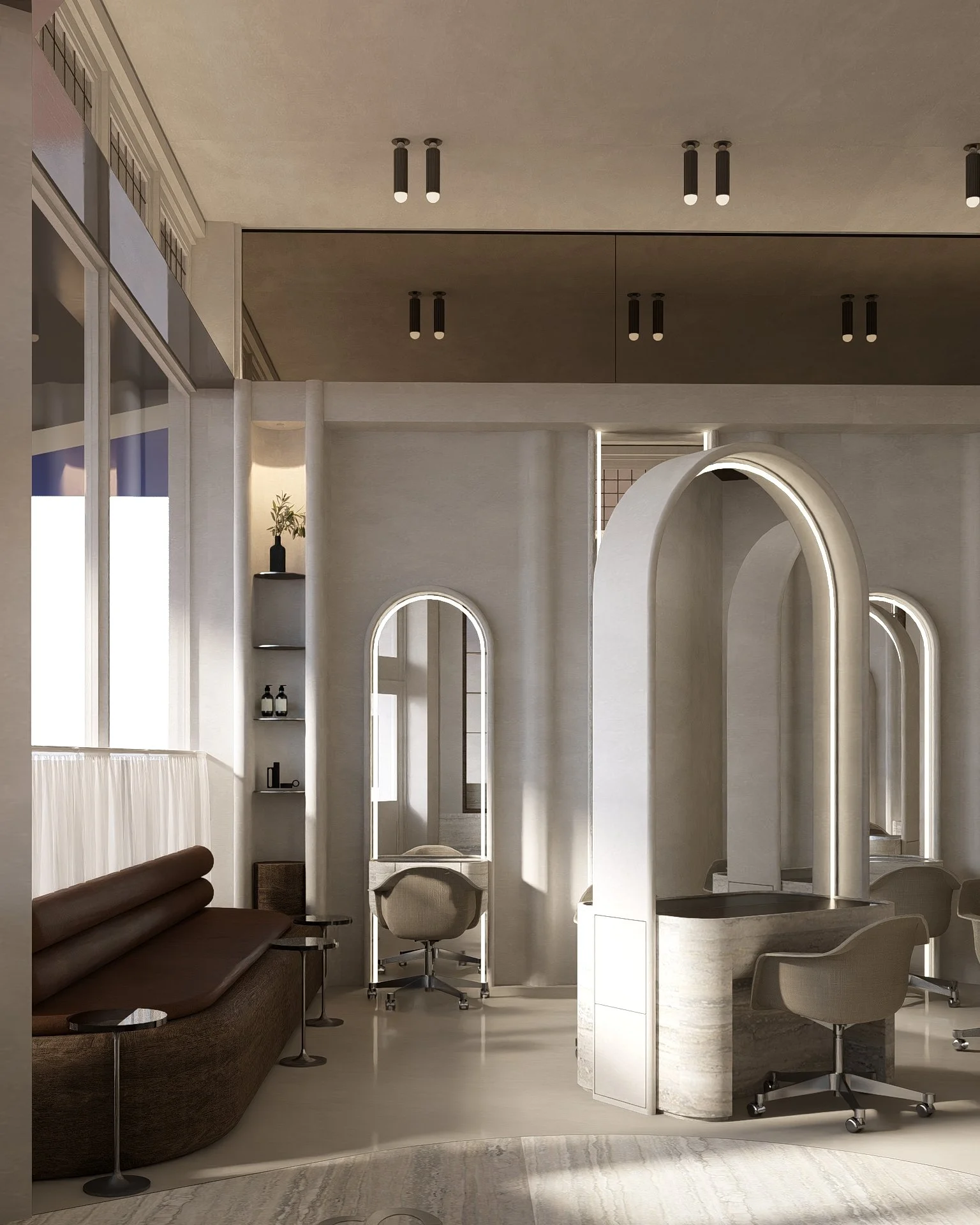 Interior of a modern, minimalistic room with a brown sofa, small round side tables, a white with rounded arch entrance, an office chair, and a decorative shelf with bottles and a plant. There are children-sized beds or seating with rounded backs and tall arched mirrors on the wall.