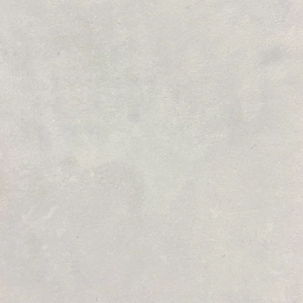 A plain, light-colored textured surface, possibly paper or wall.