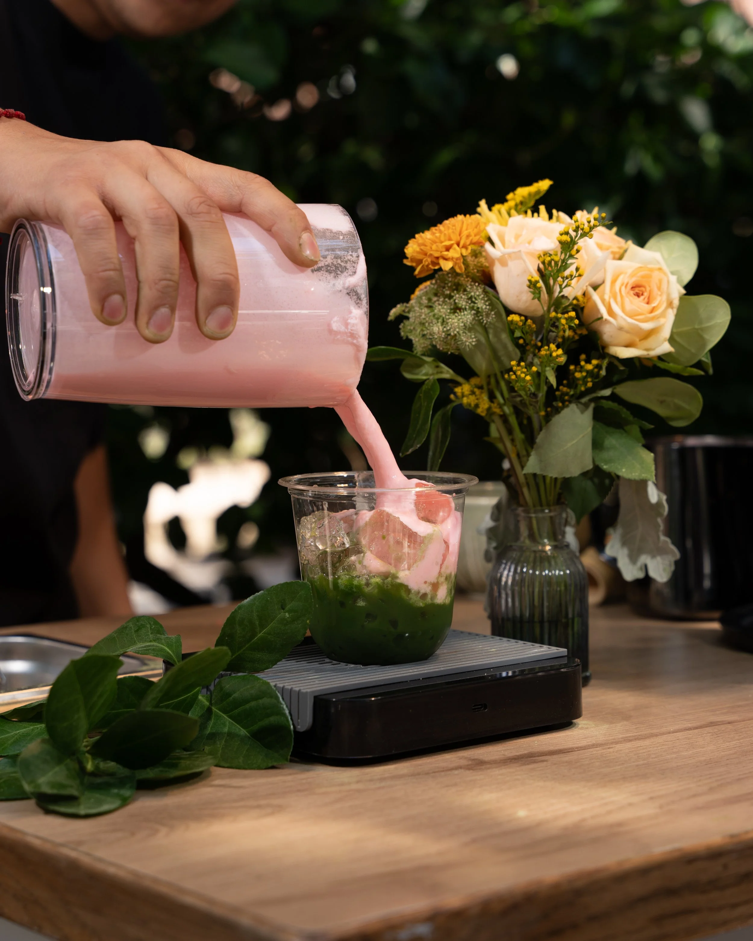 mobile barista finishing the strawberry matcha cold foam