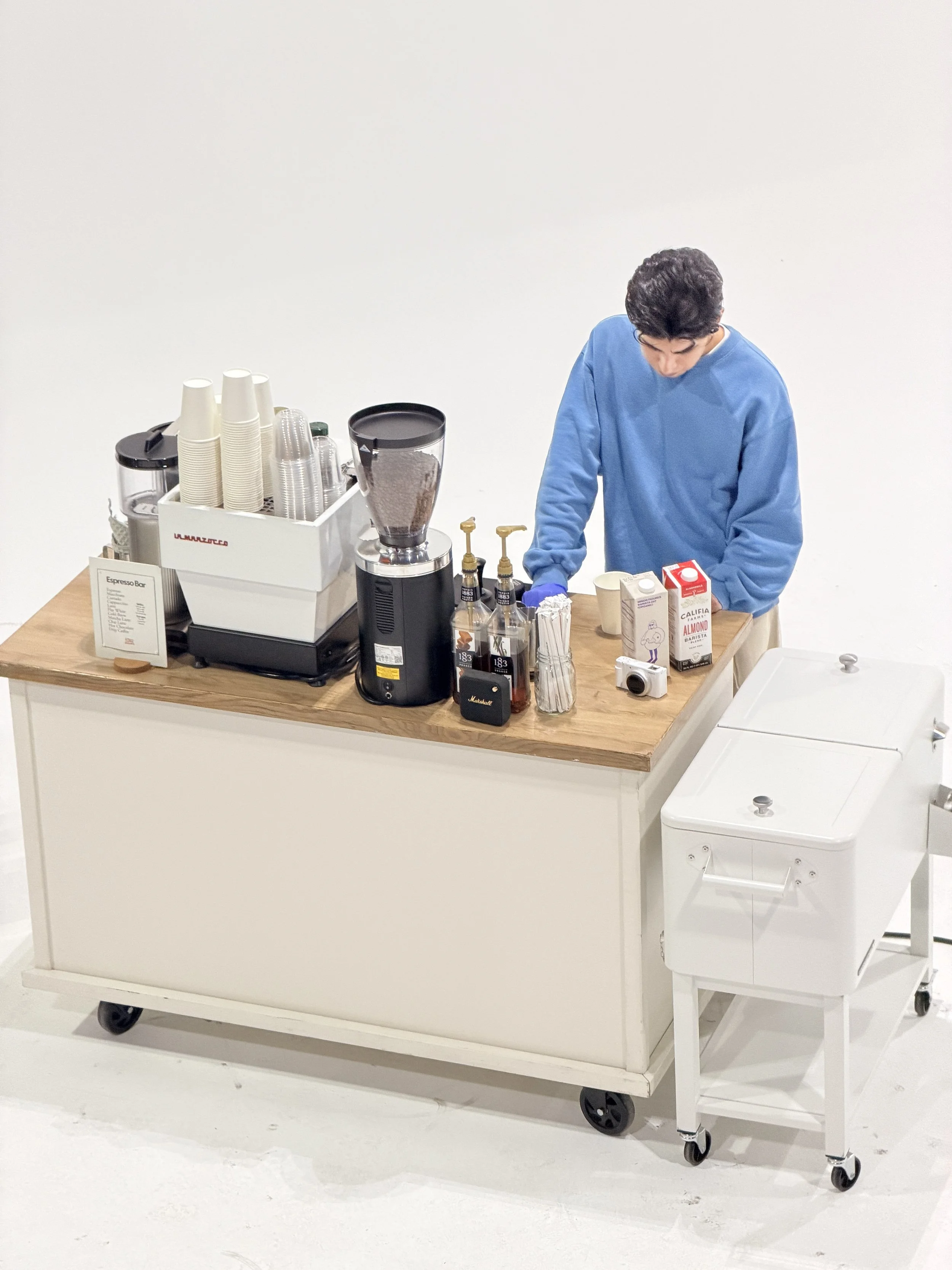 Mobile Barista preparing the coffee cart catering service in a production set in Brooklyn!