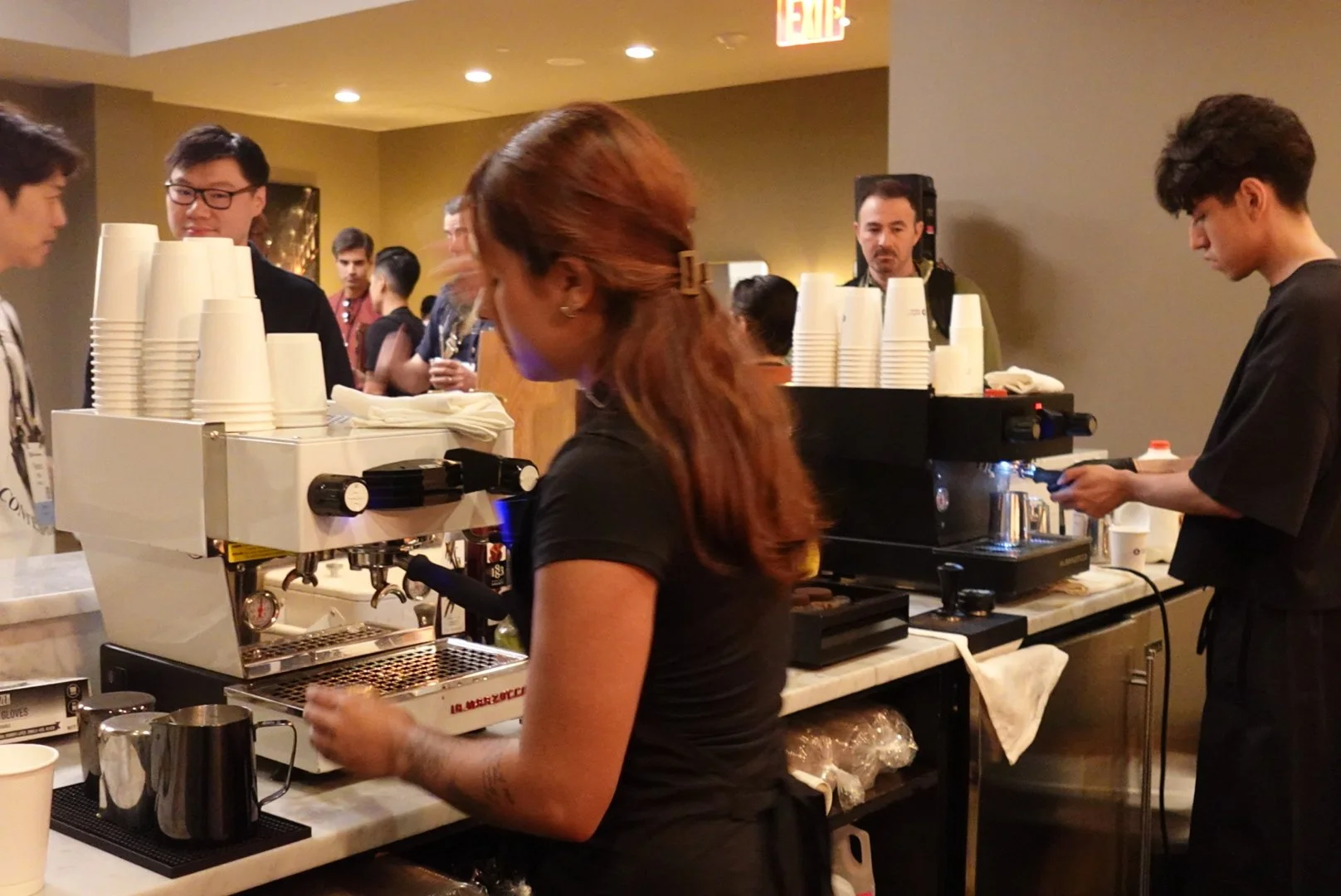 mobile baristas working fast to make as many coffees as possible in a coffee cart Manhattan conference