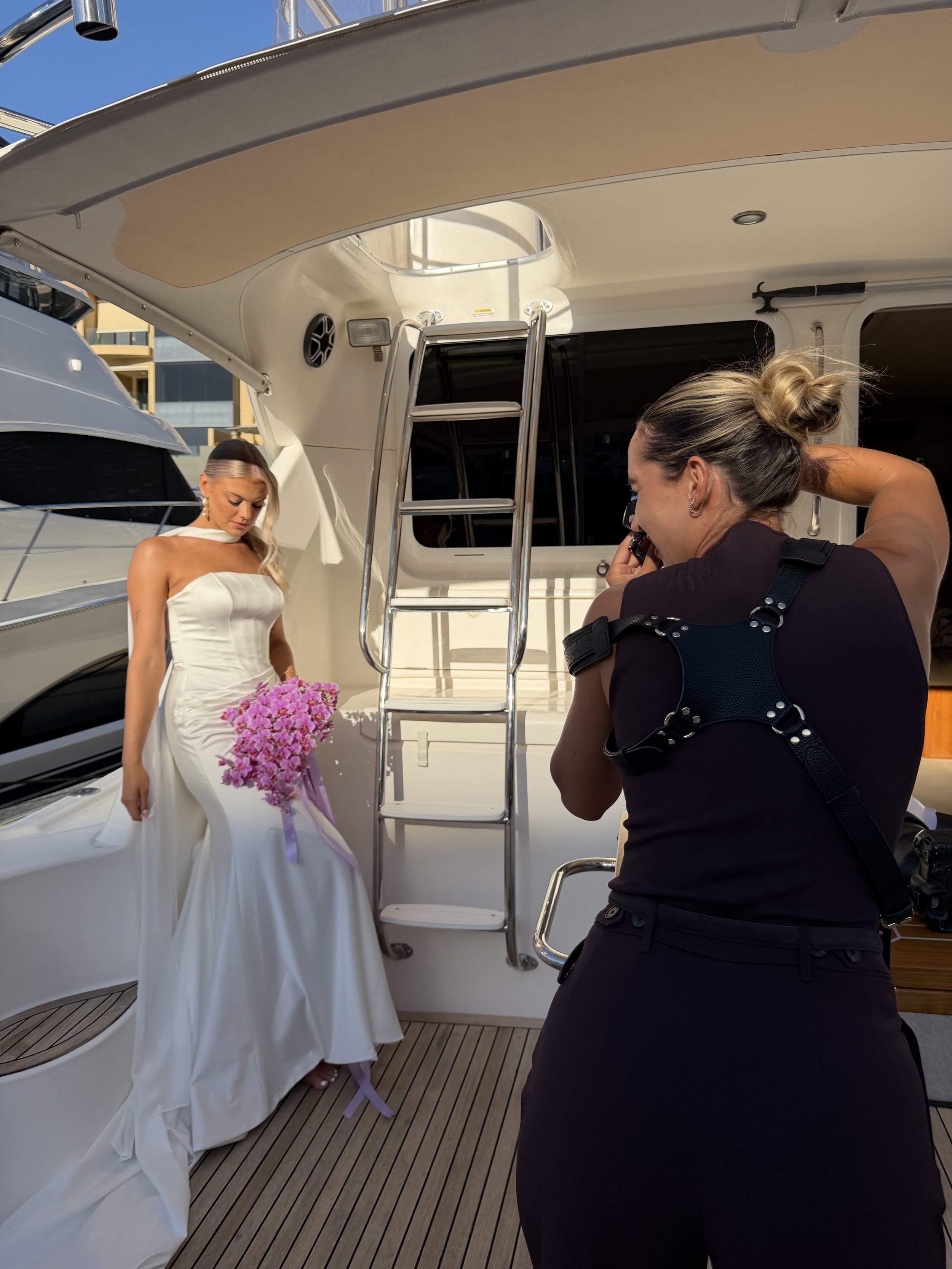 Bride wearing Jane Hill wedding gown and Anna Campbell veil on luxury yacht during editorial bridal shoot in South Australia