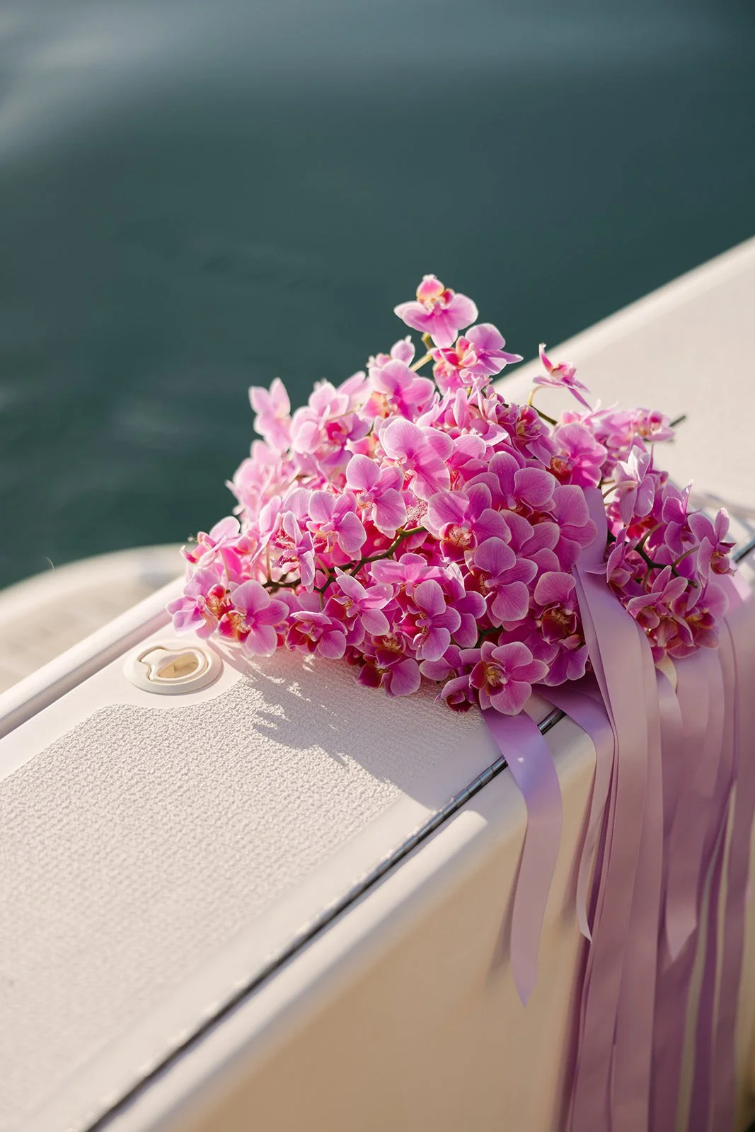 Bright pink bridal bouquet with matching ribbon styled for luxury wedding editorial