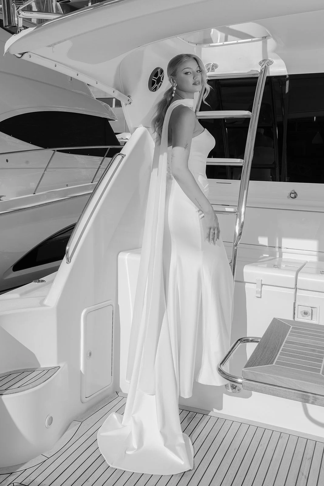 Black and white full length bridal portrait with bride looking over shoulder in Jane Hill wedding gown