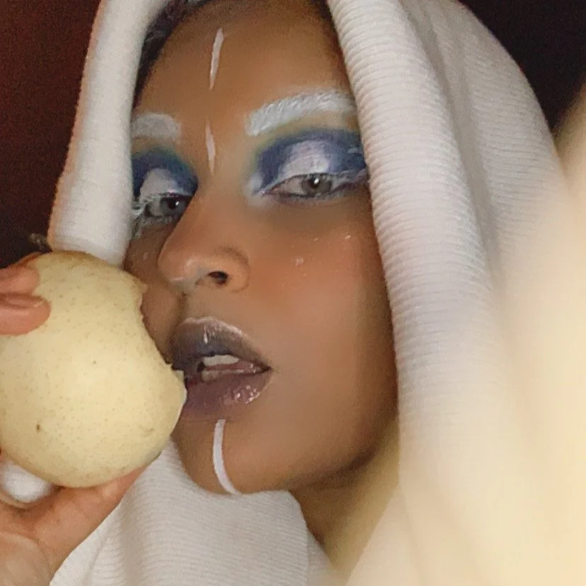 The photo showcases an imaginative Halloween look blending Elsa from *Frozen* with Snow White, masterfully created by Suhaila. The makeup combines icy elegance with classic fairytale charm, resulting in a beautifully unique and enchanting adaptation.