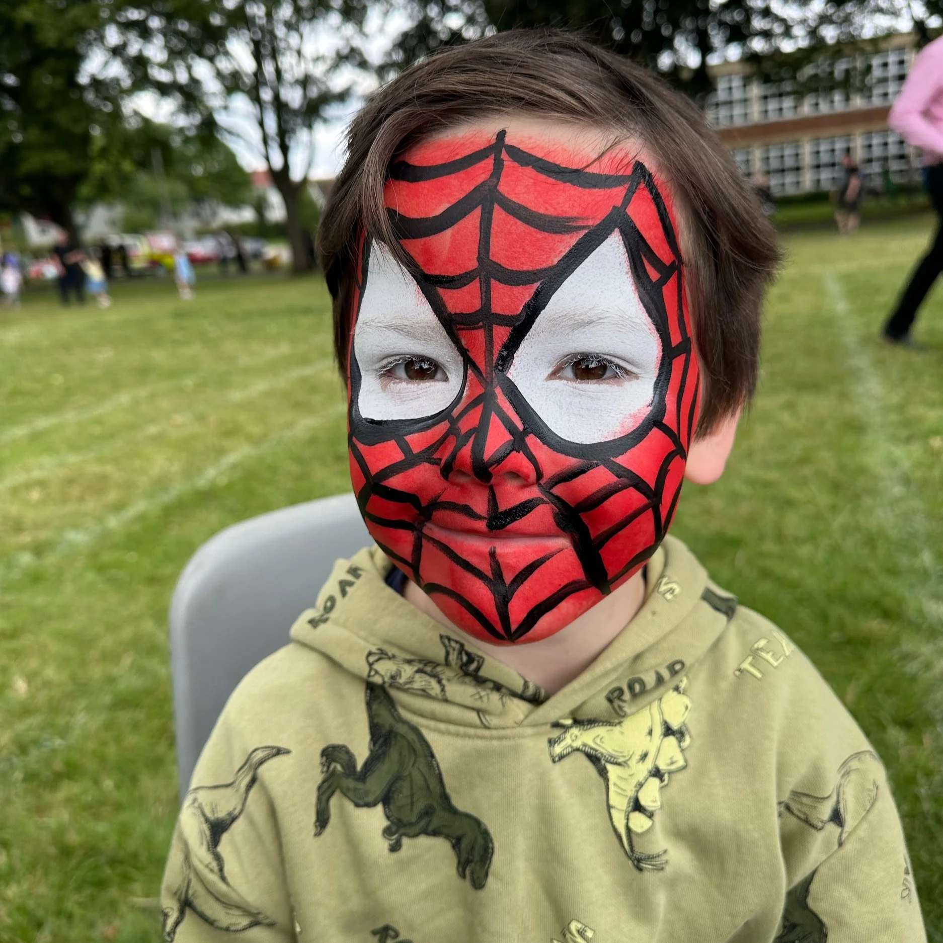 The photo showcases a vibrant Spider-Man face painting for children, skillfully brought to life by Suhaila’s creative makeup artistry.