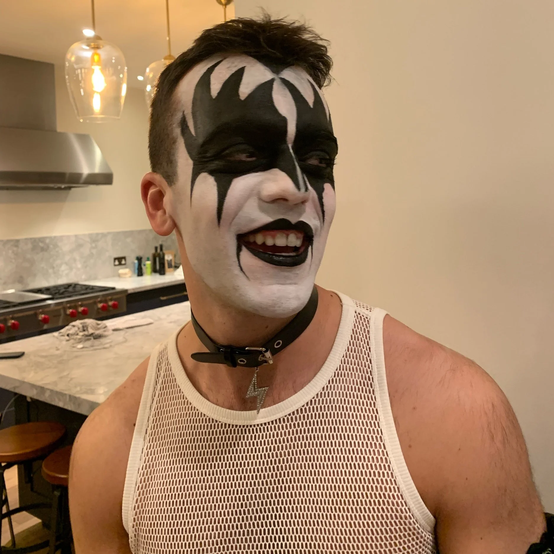 The photo features an iconic Gene Simmons look from KISS, brought to life with Suhaila’s expert makeup artistry. The dramatic design captures the legendary rock star’s bold style with striking precision and intensity.