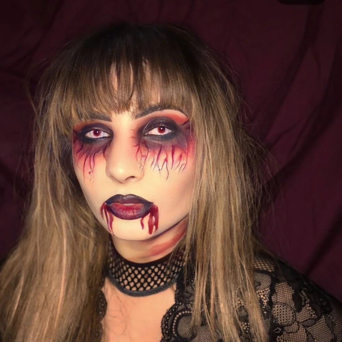 The photo features a sultry vampire Halloween look, expertly crafted by Suhaila. The makeup combines seductive elegance with dark, dramatic elements for a truly captivating and alluring appearance.