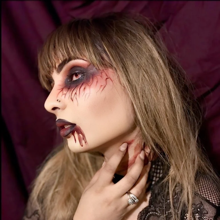 The photo highlights a glamorous and seductive vampire Halloween look, expertly designed by Suhaila. The makeup blends dramatic elegance with a touch of dark allure, creating a strikingly sexy and sophisticated appearance.