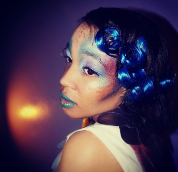 The photo showcases an enchanting mermaid Halloween look, expertly designed by Suhaila with special effects makeup, a detailed hair piece, and an intricate prosthetic. The costume enhances the magical theme, combining shimmering scales and vibrant co