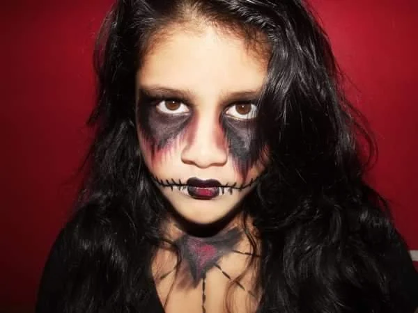The photo presents a gothic, Tim Burton-inspired "Corpse Bride" look, crafted with striking makeup artistry by Suhaila to evoke a hauntingly elegant charm.