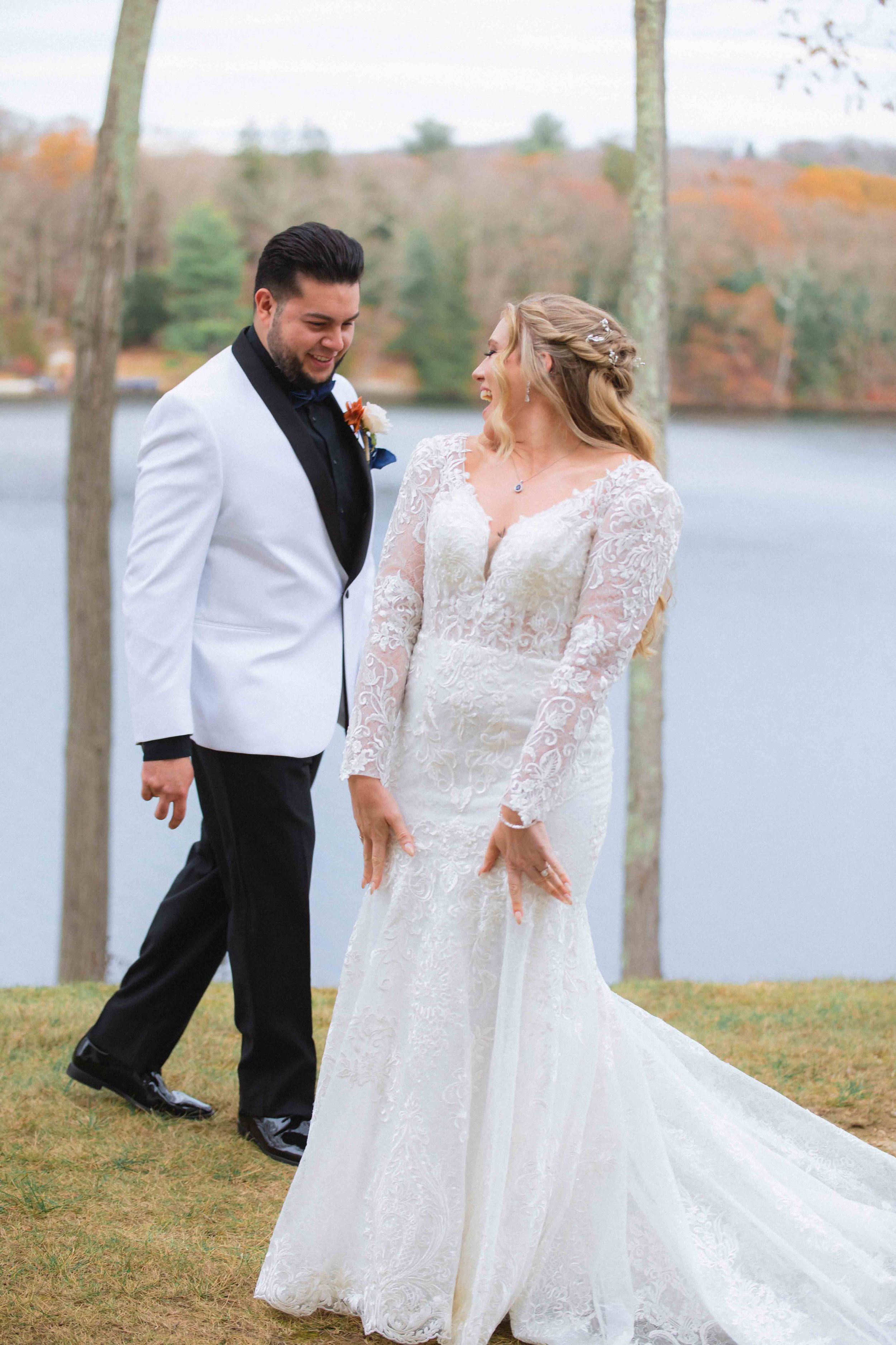 groom gets a great first look at all the angles of brides dress at the waterview wedding venue in monroe ct