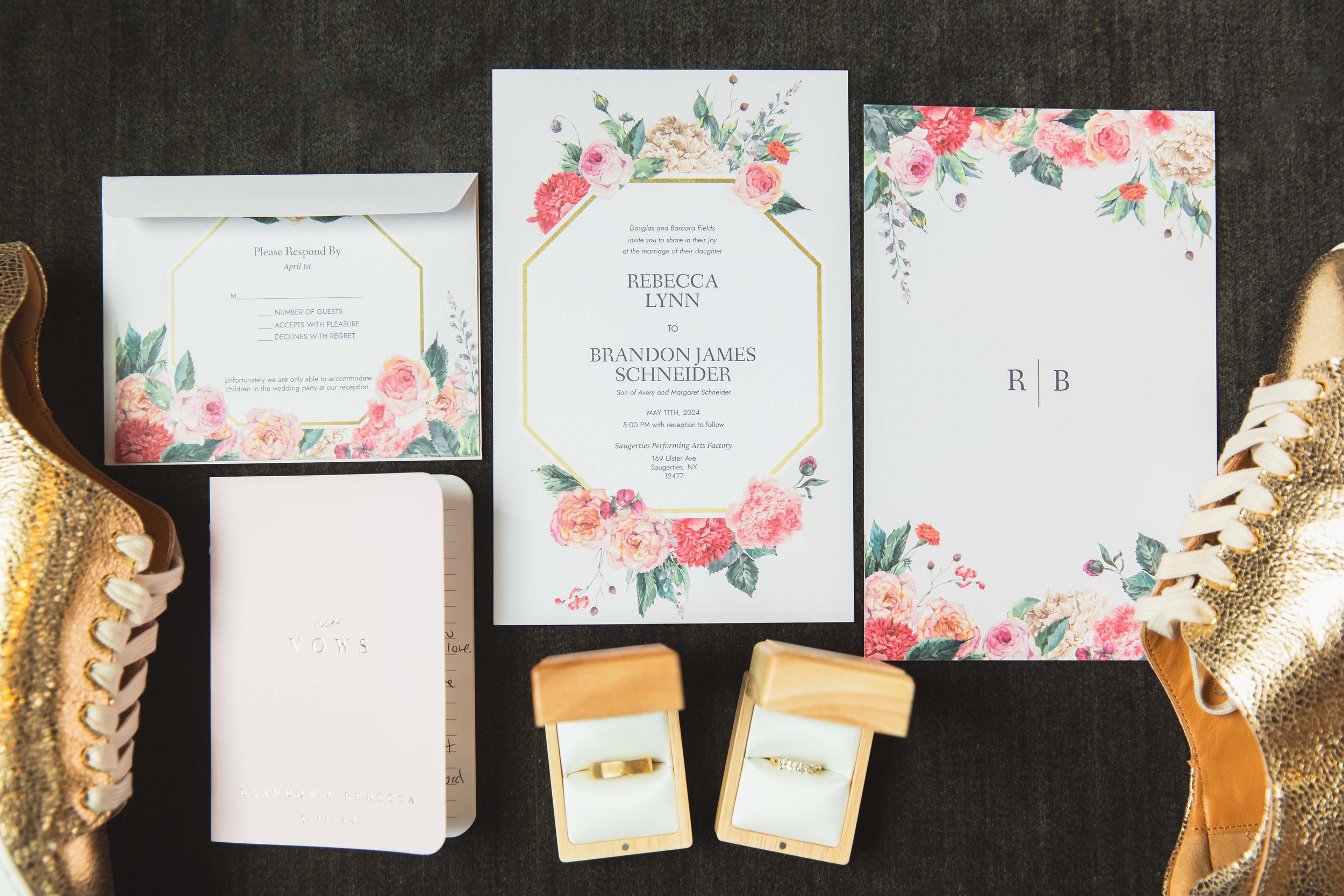 wedding invitation suite flat lay with rings shoes and vow book at Saugerties Performing Arts Factory wedding venue in upstate NY