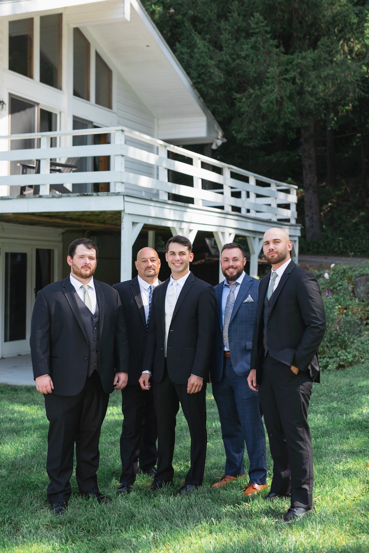groom and groomsmen outside cabin getting ready before wedding in catskills, NY