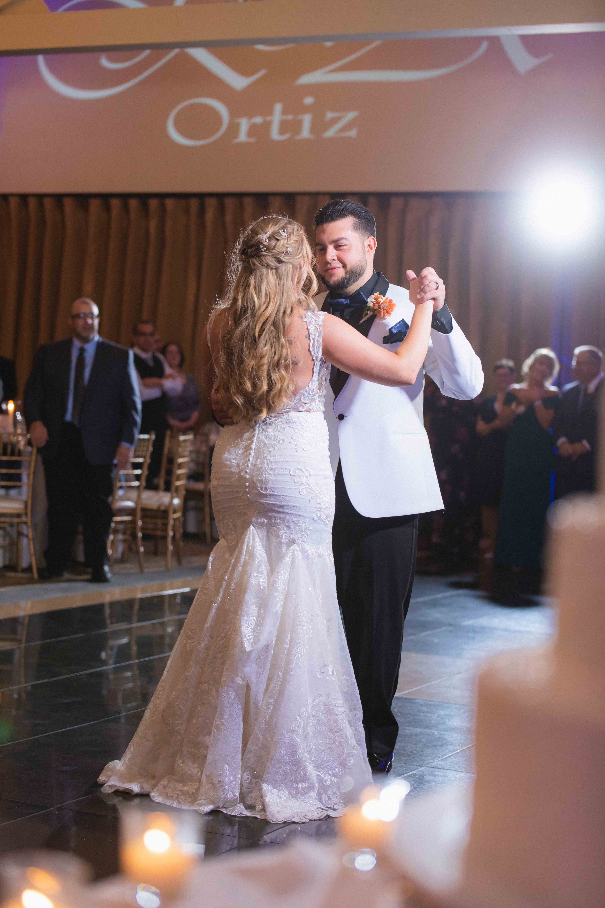 bride and groom share first dance in ballroom during reception at the waterview wedding venue in monroe ct
