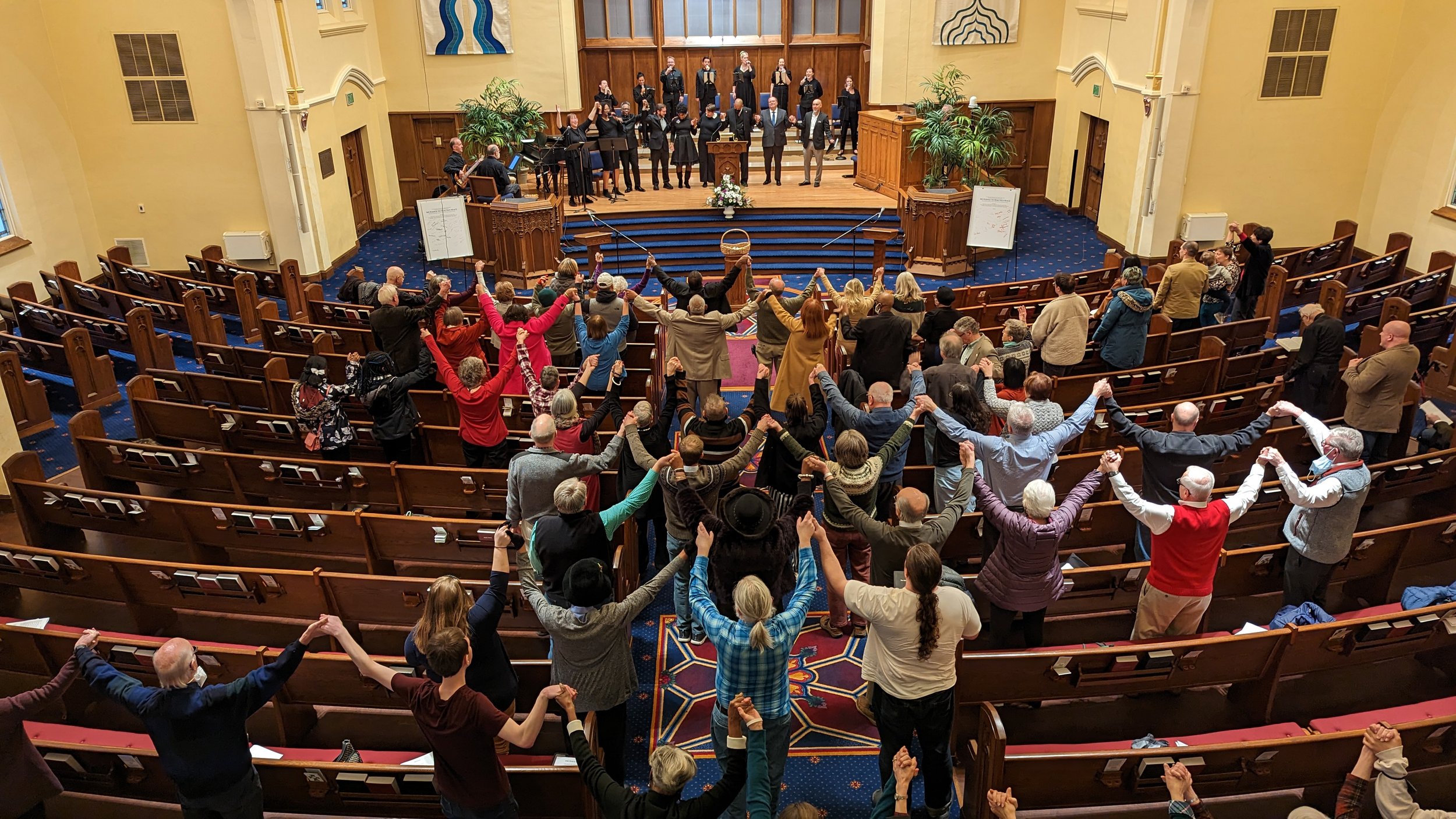 Copy of We Shall Overcome Hands Raised.jpg