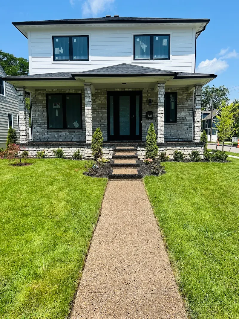 Exposed aggregate concrete porch installed by Metro Detroit concrete contractor