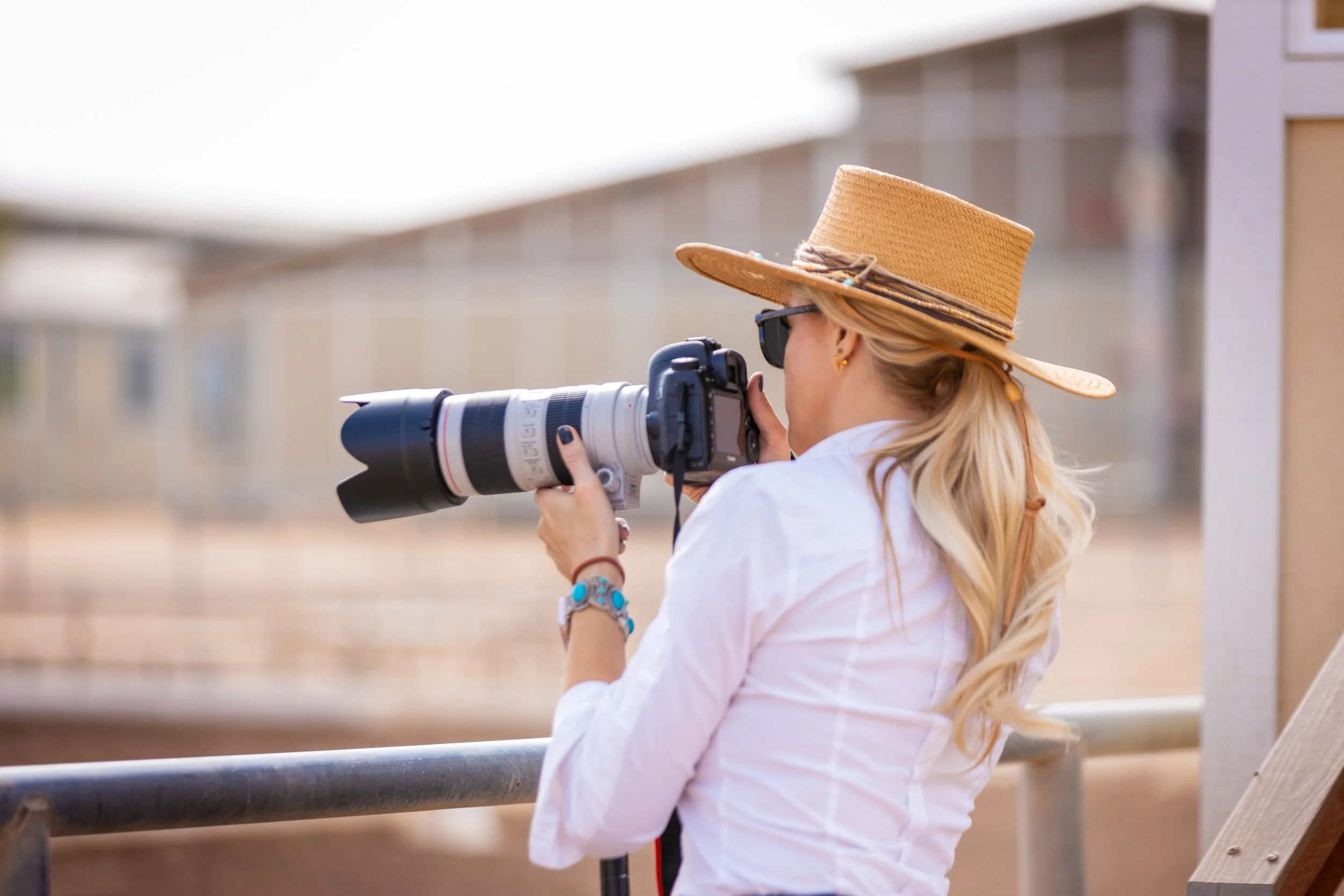 Jenna Oxford photographing a horse show, WestWorld, Scottsdale, AZ.